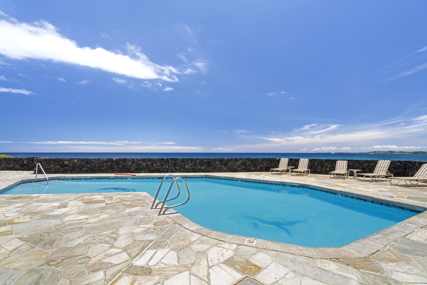 Kailua Kona Vacation Rentals, Sea Village 1105 - Refresh in the sparkling pool, with endless blue sky and sea as your backdrop.