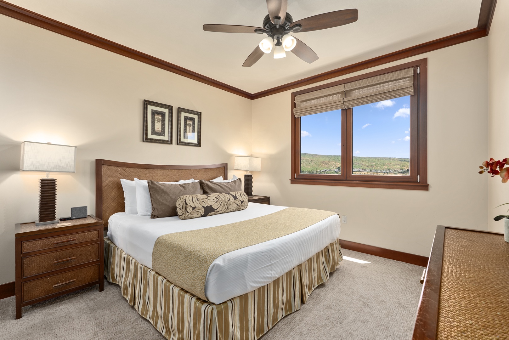 Kapolei Vacation Rentals, Ko Olina Beach Villas O1404 - The primary suite's windows frame the coastline, the king bed set to face the water.