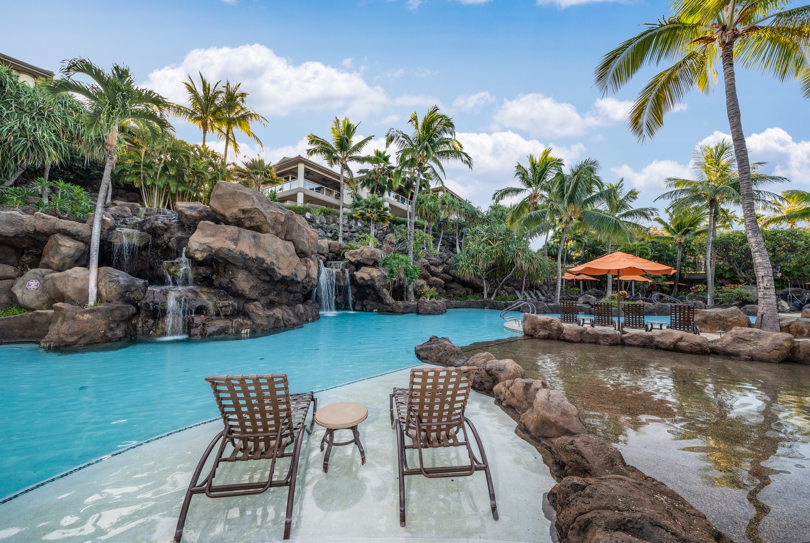 Wailea Vacation Rentals, Wailea Luxury Residence Hoolei 23-3 - Lounge in comfort poolside at Wailea Luxury Residence Hoolei 23-3 with views of waterfalls.