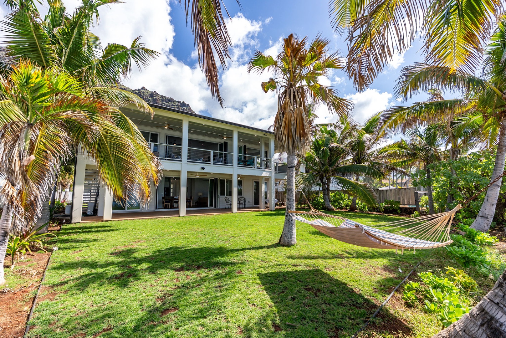 Waianae Vacation Rentals, Oceanfront Luxury Dream Estate - View of the estate from the ocean side shows its scale, privacy, and manicured surroundings.