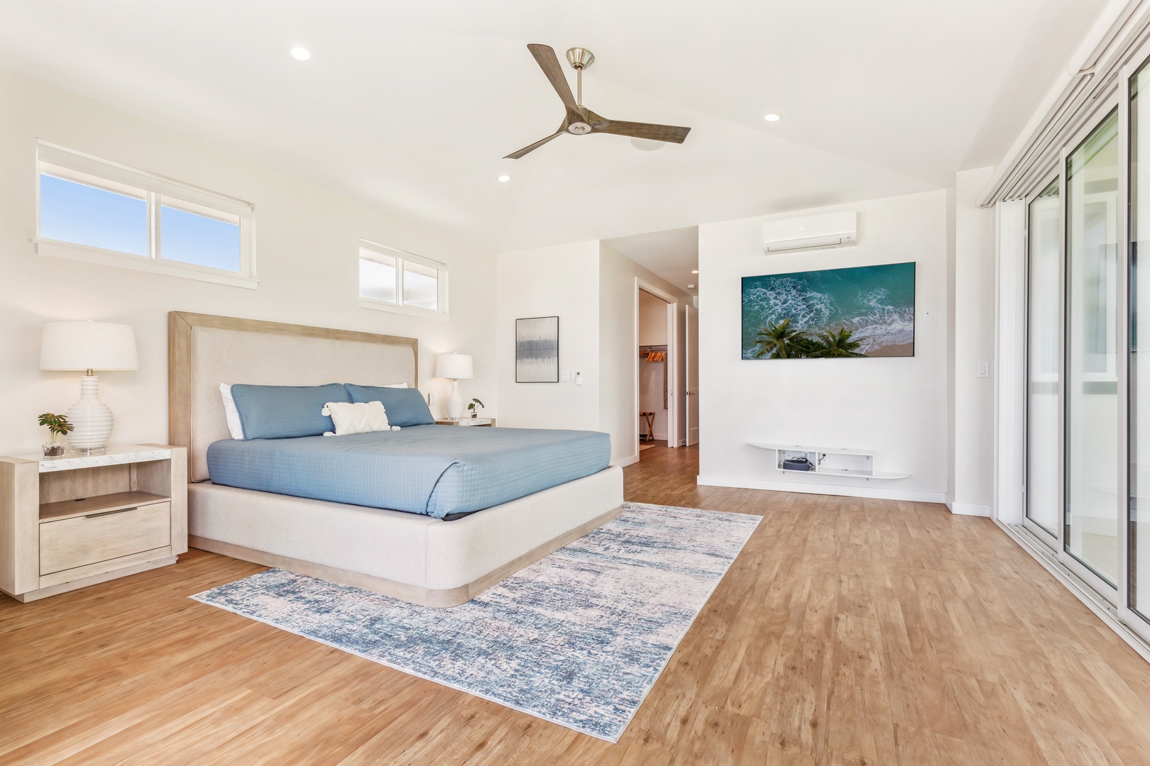 Laie Vacation Rentals, Majestic Mahakea Oceanfront Oasis - Serene primary bedroom retreat with elegant decor, natural light, and a tranquil ambiance.