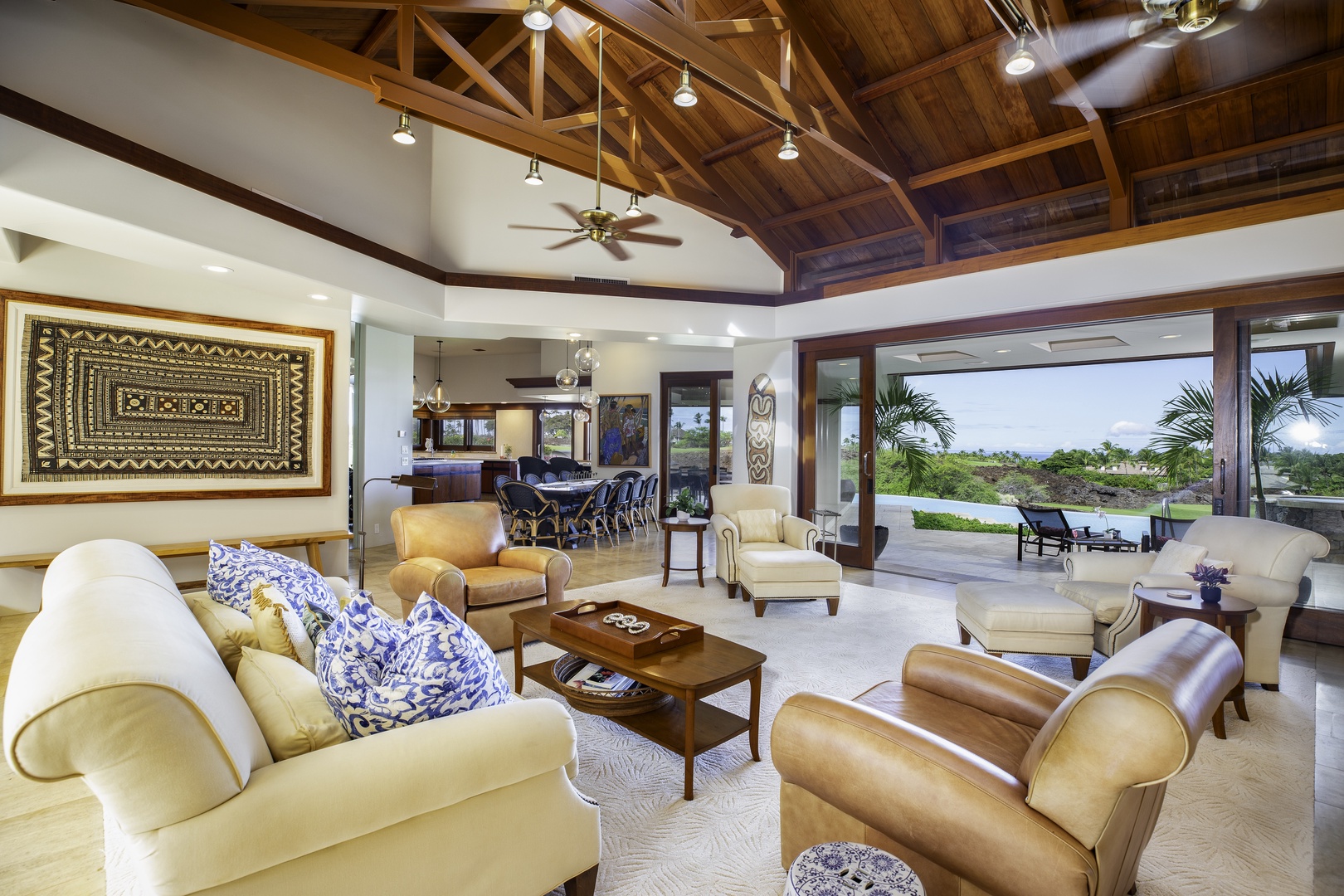 Kamuela Vacation Rentals, Champion Ridge 7 - Unwind in your luxurious living space with soaring wooden ceilings, plush leather seating, and seamless indoor-outdoor flow to tropical views.
