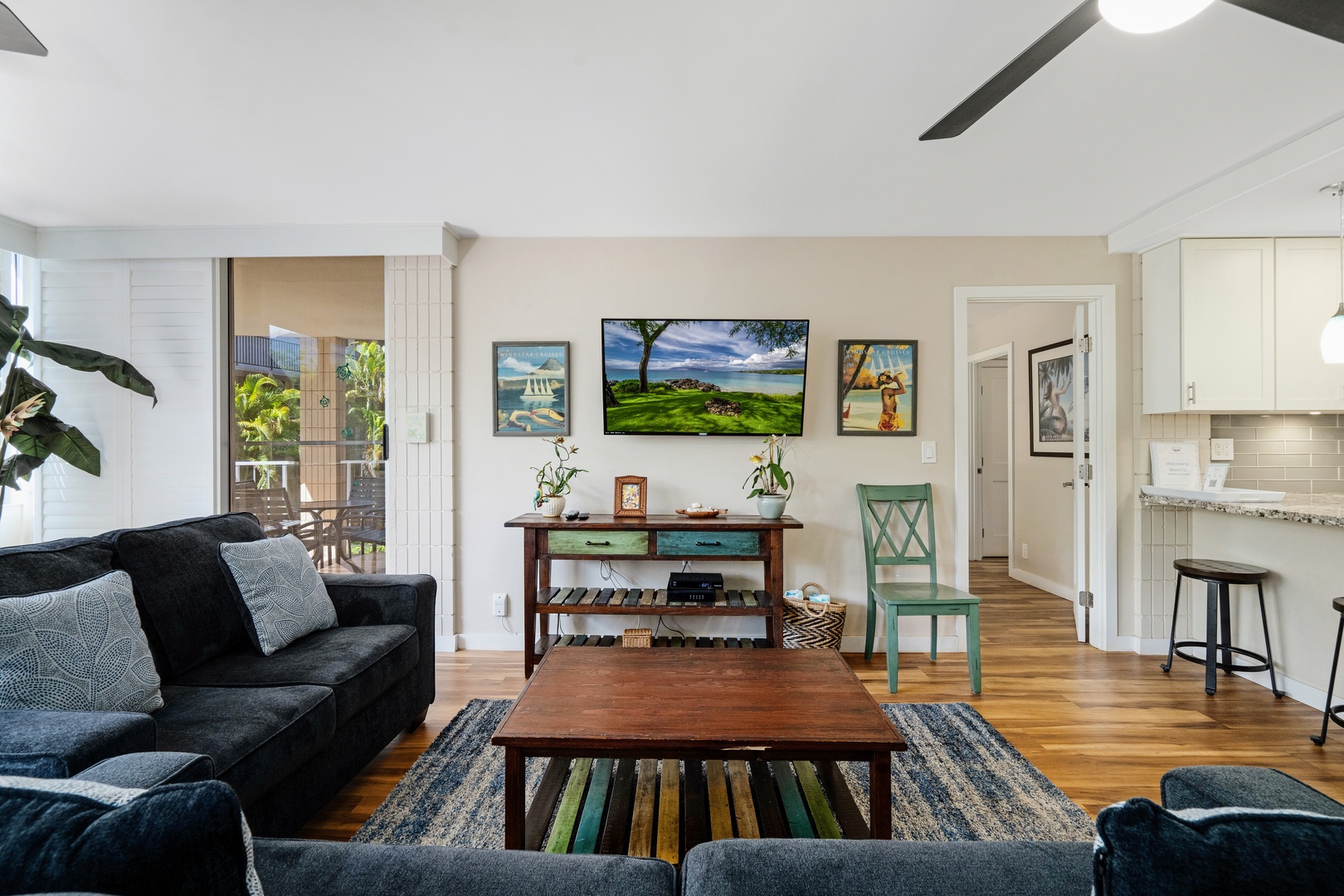 Kihei Vacation Rentals, Haleakala Shores A206 - The bedroom door stands open beyond the sofas, ready for whoever needs to slip away and recharge.