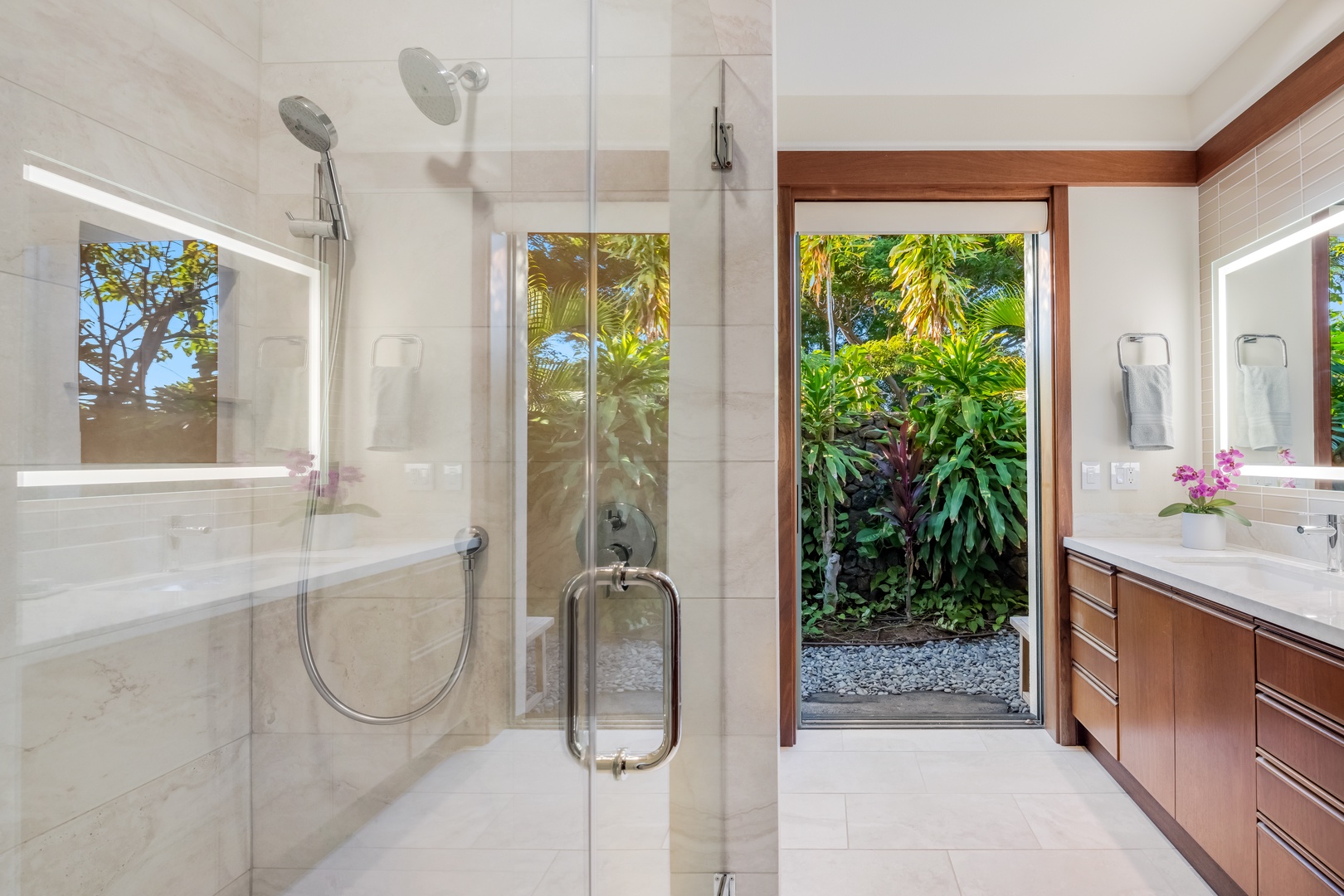 Kamuela Vacation Rentals, Champion Ridge Elegance - Guest Suite 2 ensuite bathroom with enclosed glass shower with tiled walls and a built-in seat for ultimate comfort.