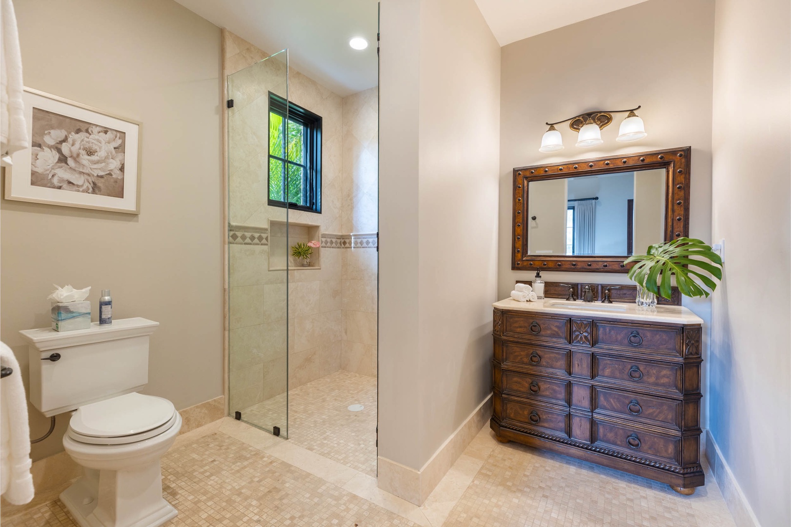 Honolulu Vacation Rentals, The Kahala Mansion Event Venue - Modern bathroom with a glass walk-in shower, wooden vanity, and stylish finishes.