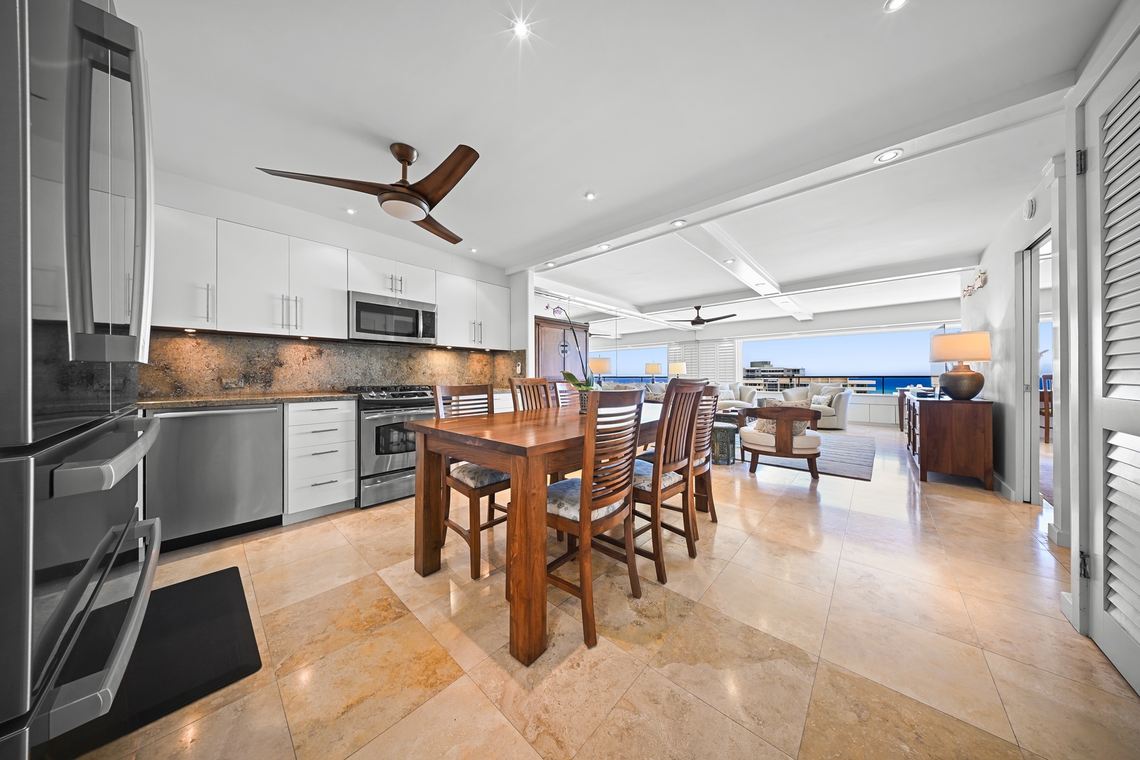 Honolulu Vacation Rentals, Kaimana Shores Getaway - The open kitchen and dining area flow seamlessly into the living space, making it easy to gather for meals after a day at Kaimana Beach.