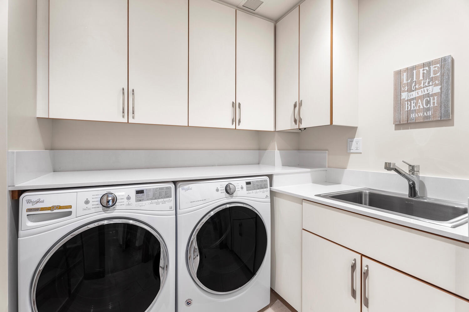 Kamuela Vacation Rentals, Laule'a at the Mauna Lani Resort #14 - Full laundry room with washer, dryer, utility sink, and plenty of storage space.