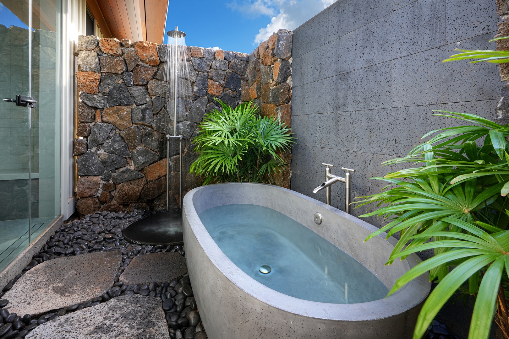 Koloa Vacation Rentals, Hale Ka Pua Ola at Kukuiula - Private outdoor soaking tub surrounded by lush greenery for ultimate relaxation.