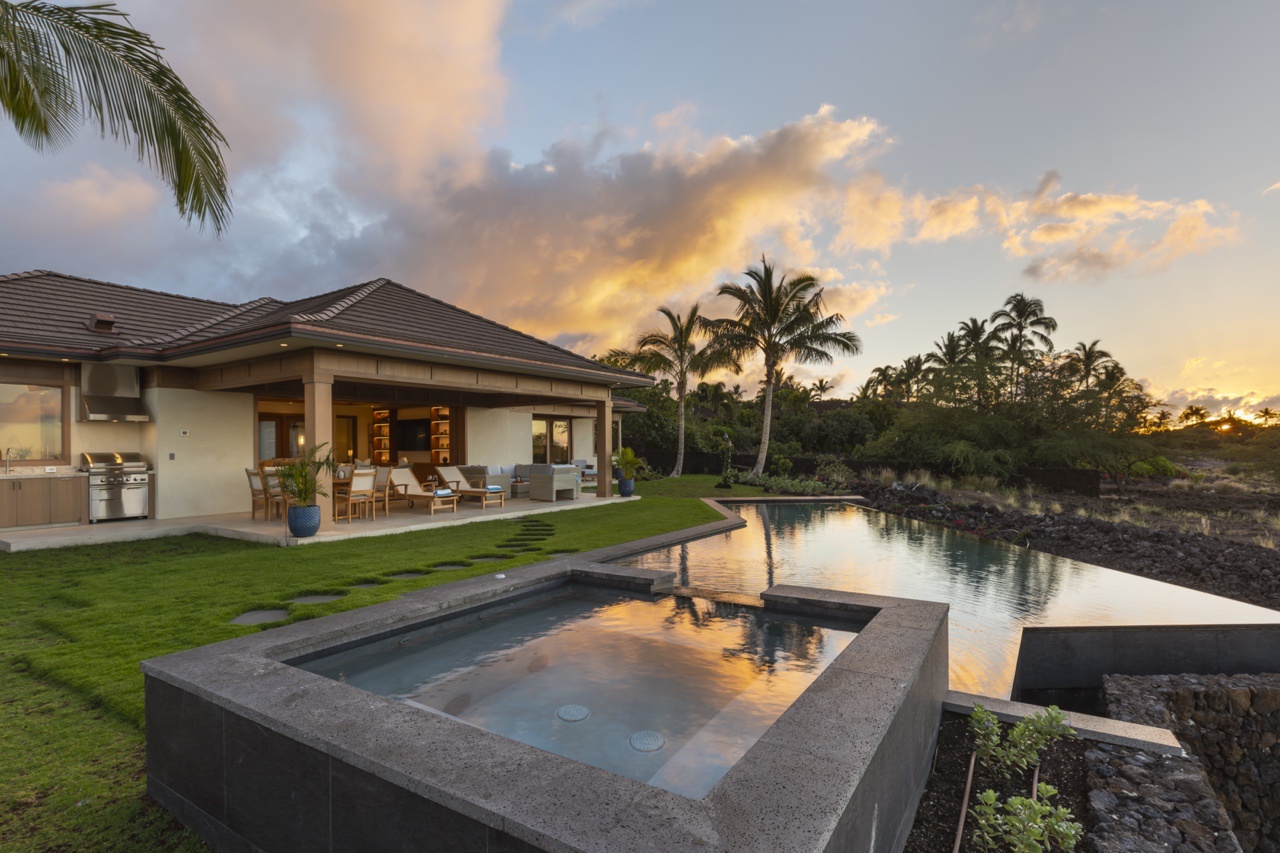 Kailua Kona Vacation Rentals, 4BR Luxury Puka Pa Estate (1201) at Four Seasons Resort at Hualalai - Twilight by the poolside area featuring the custom outdoor kitchen area.