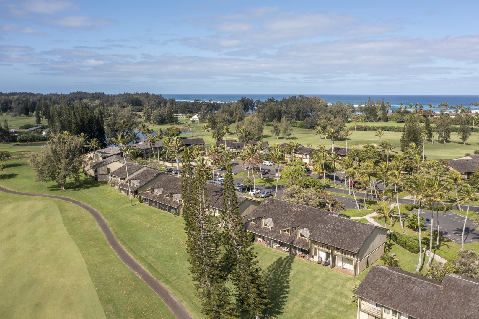 Kahuku Vacation Rentals, Pulelehua Kuilima Estates West #142 - View of the condos and adjacent golf course cart path