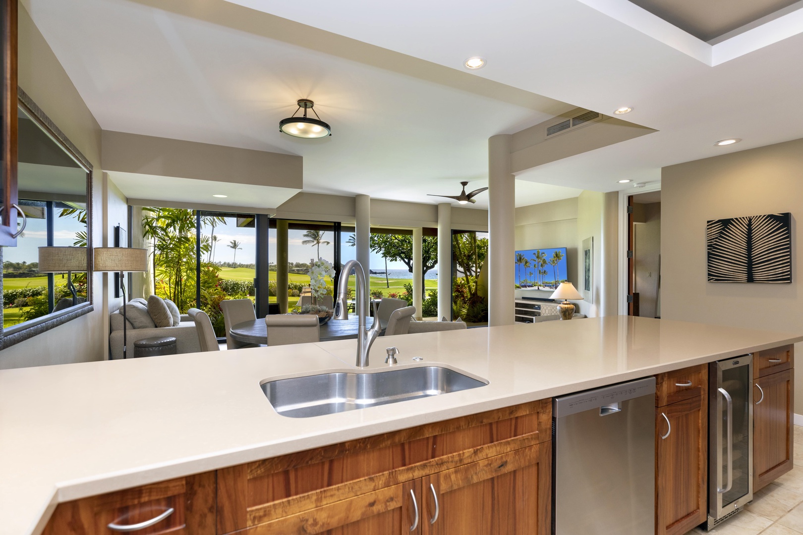 Kamuela Vacation Rentals, Mauna Lani Point E105 - Enjoy serene golf course views while cooking in this beautifully equipped kitchen.