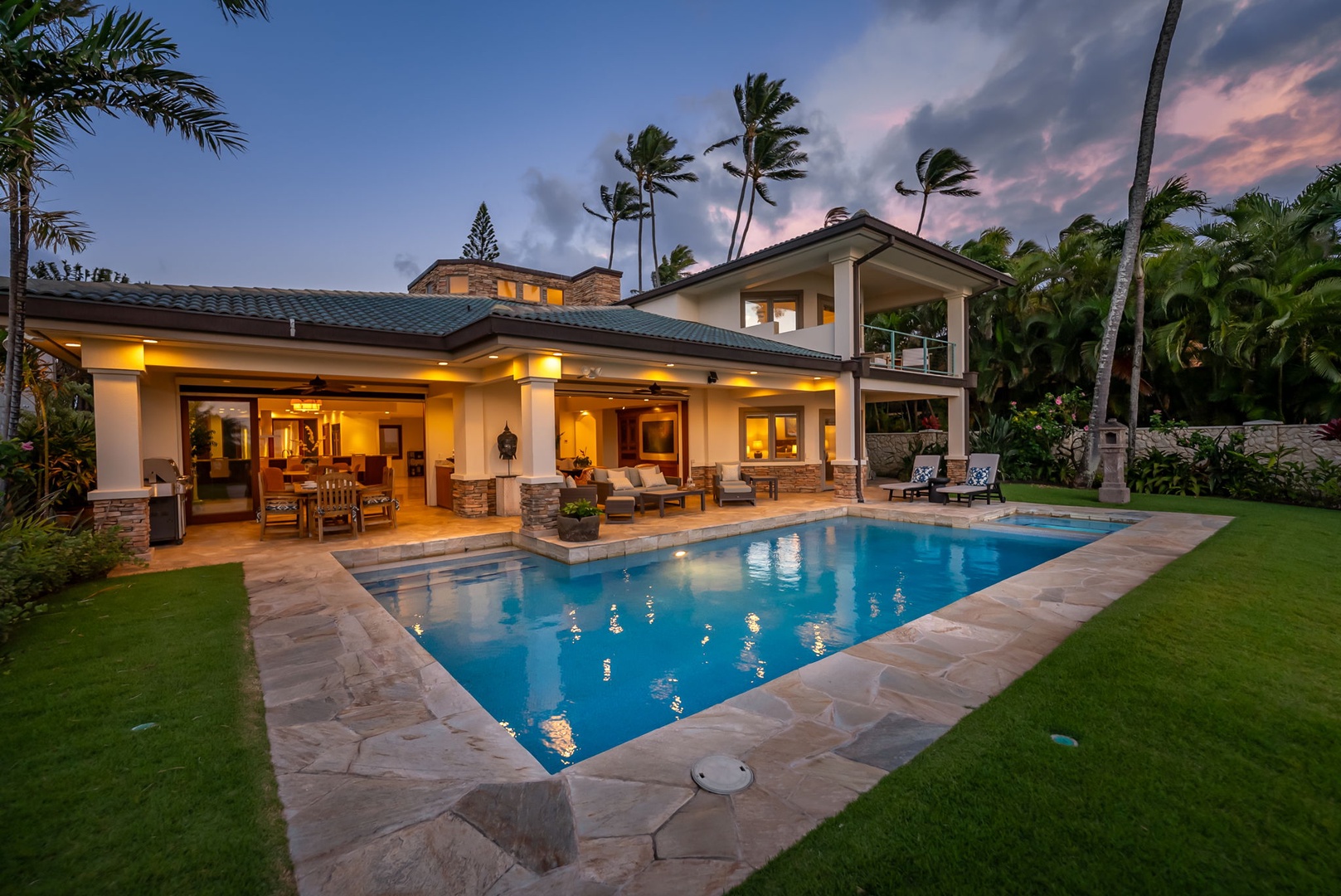 Honolulu Vacation Rentals, Maunalua Estate - Sunset reflections shimmer across the pool as palms sway in the evening breeze.