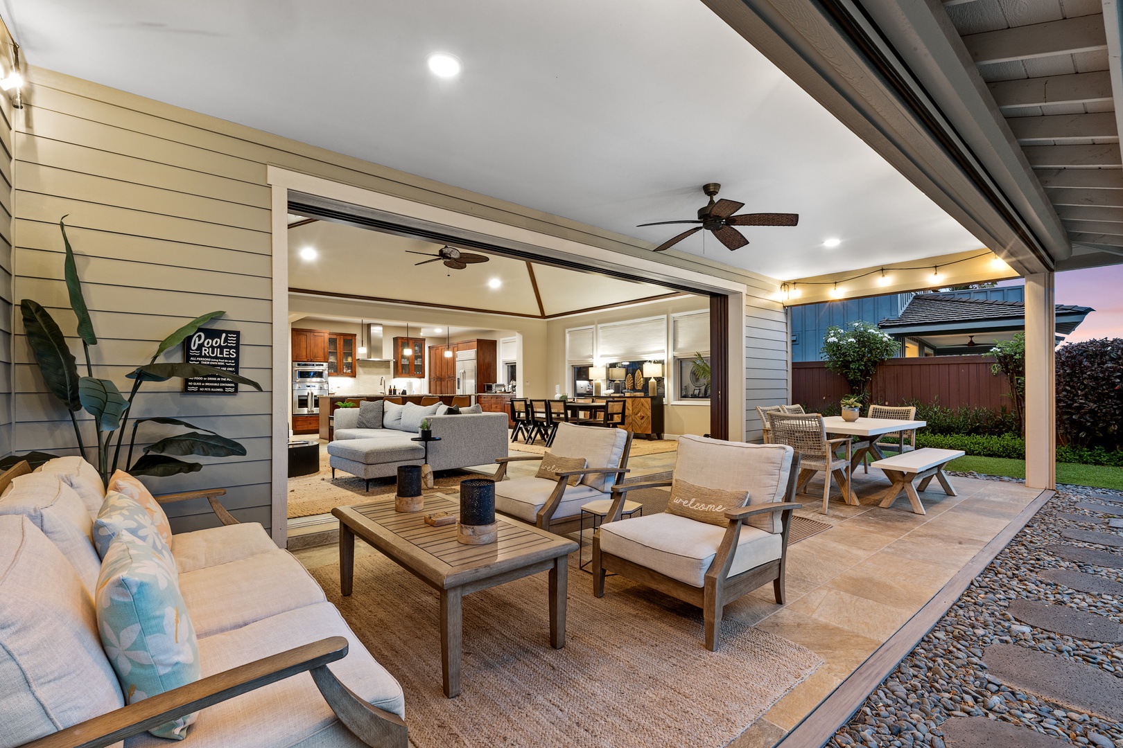 Kailua Kona Vacation Rentals, Holua Kai #27 - Evening on the lanai, the fan turning slow over the sofas as the sky fades.