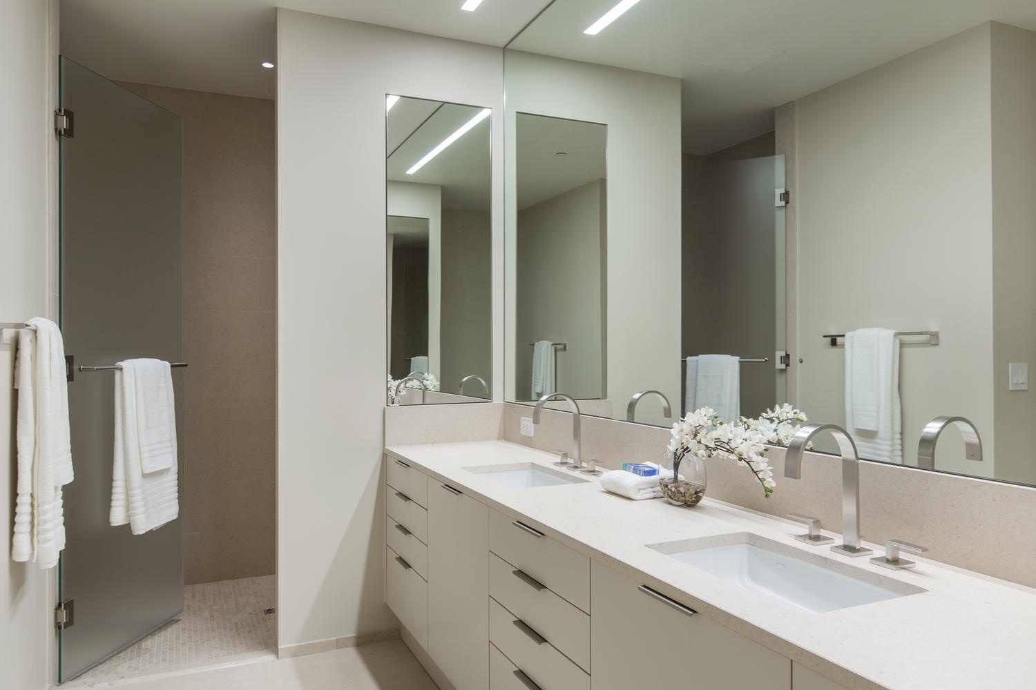 Honolulu Vacation Rentals, Park Lane Sunset Resort - Your elegant ensuite features dual vanities and a spacious glass-enclosed shower for luxurious morning routines.