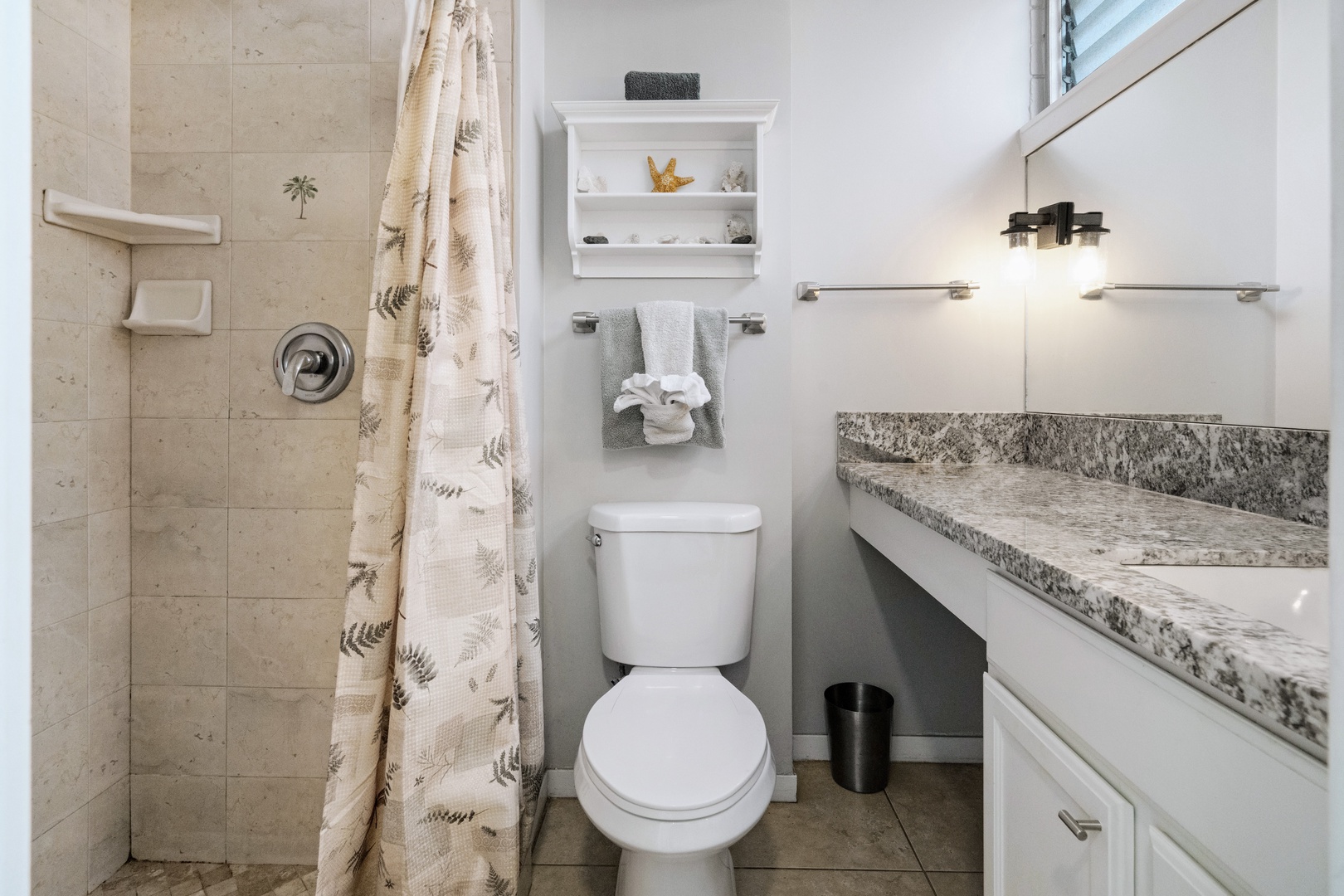 Kihei Vacation Rentals, Haleakala Shores A206 - Palm leafs tiled into the shower wall is a small, permanent souvenir of where you are.