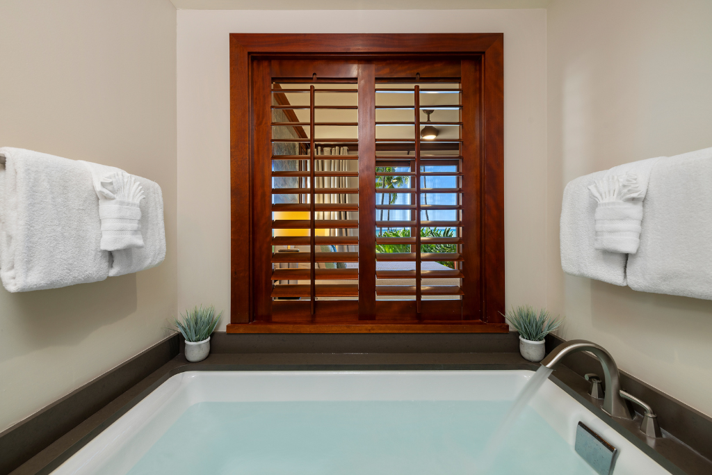 Kapolei Vacation Rentals, Ko Olina Beach Villas B109 - The large soaker tub, dual vanity and walk in shower provide primary ensuite luxury.