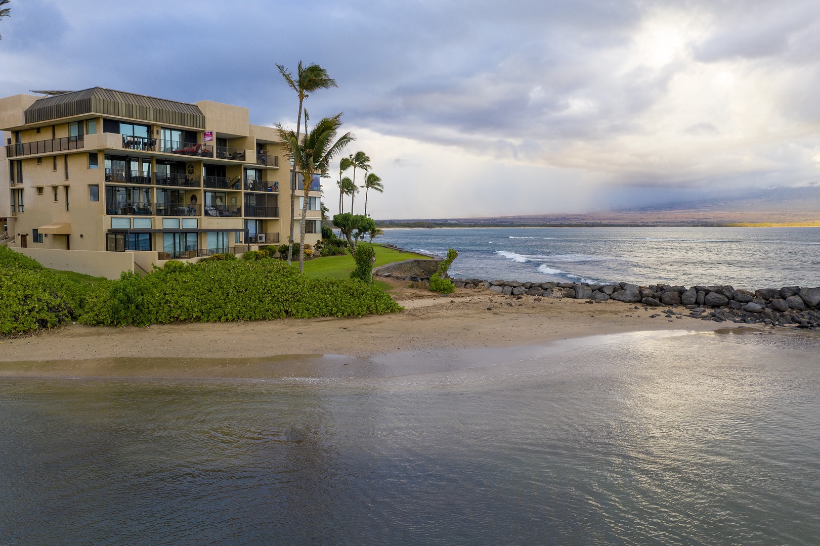 Wailuku Vacation Rentals, Milowai 310 - Right where the sand meets the surf, the building claims its own quiet stretch of coastline.