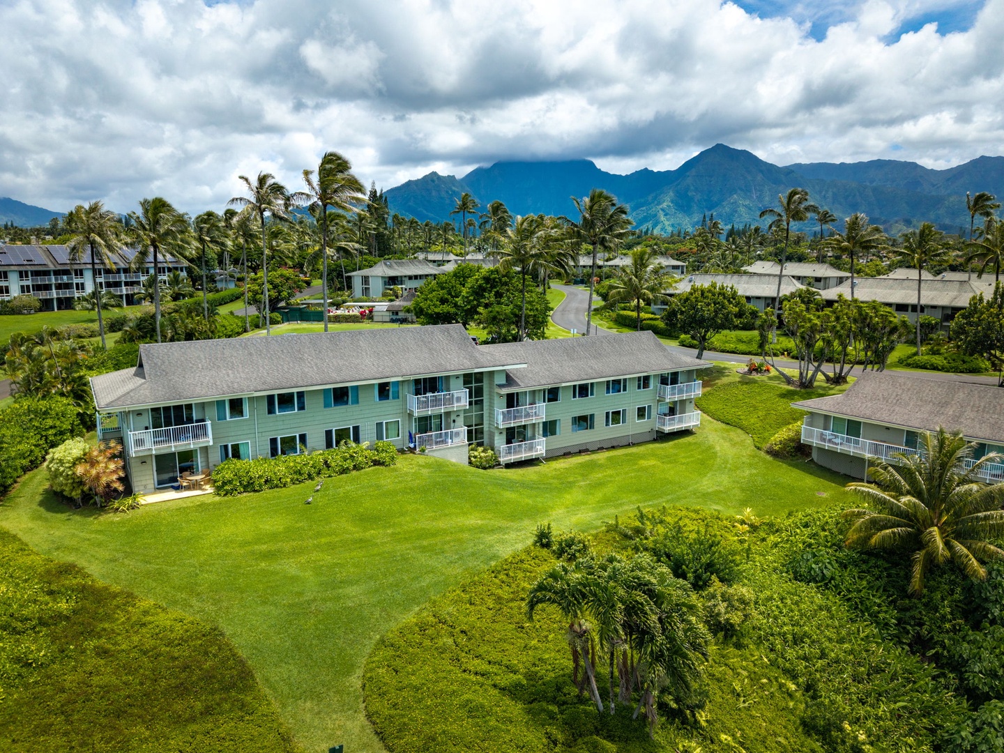 Princeville Vacation Rentals, Alii Kai 7201 - The community spreads across the bluff with the mountains rising behind.