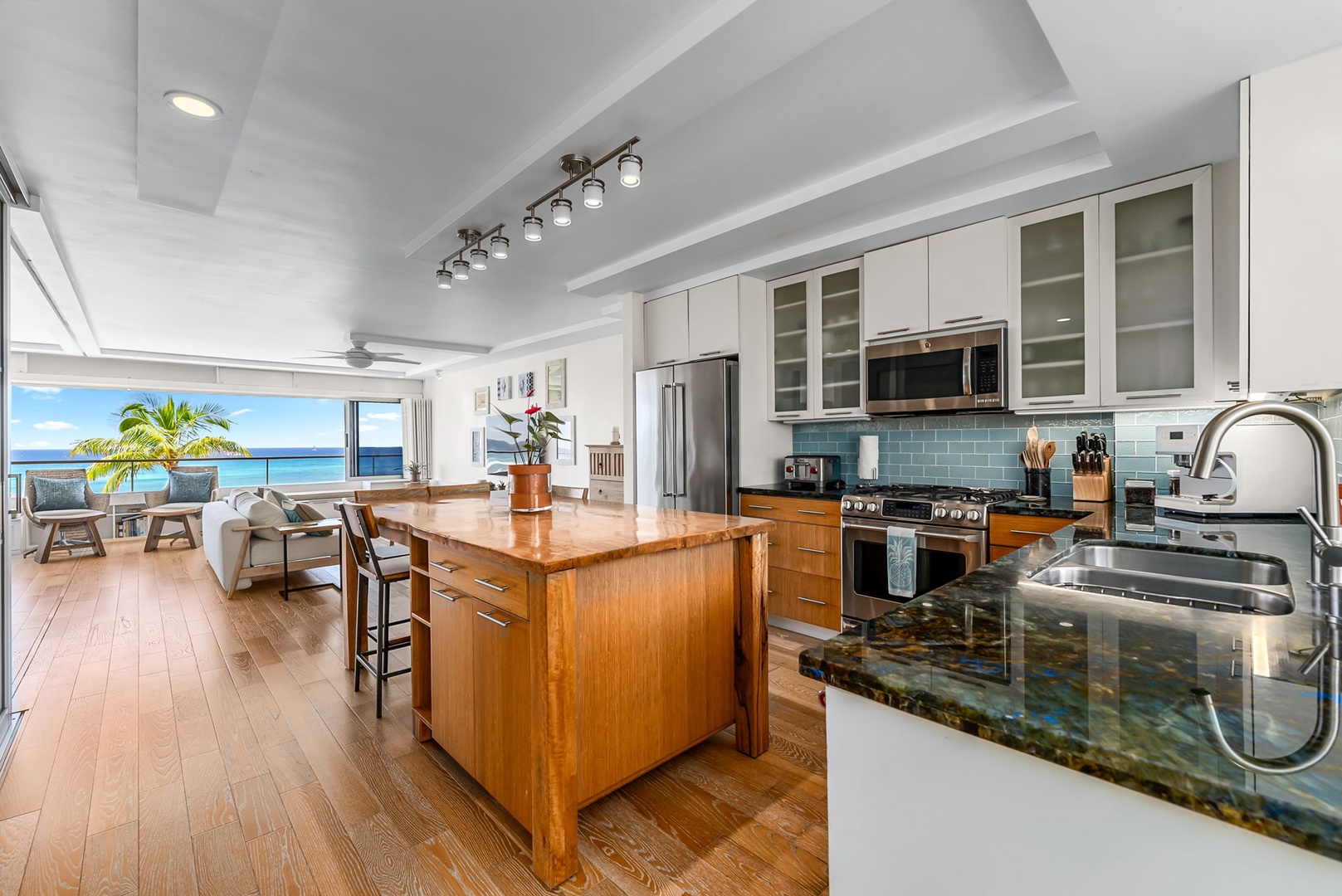 Honolulu Vacation Rentals, Colony Surf Luxe - Gourmet-style kitchenette with granite counters, full-size fridge, and custom cabinetry.