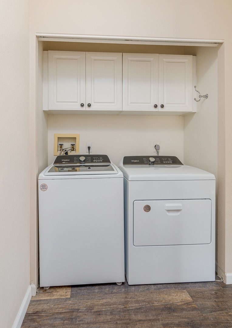 Kapolei Vacation Rentals, Fairways at Ko Olina 8G - Your dedicated laundry nook keeps clothes fresh with a full-size washer and dryer, plus convenient storage above.