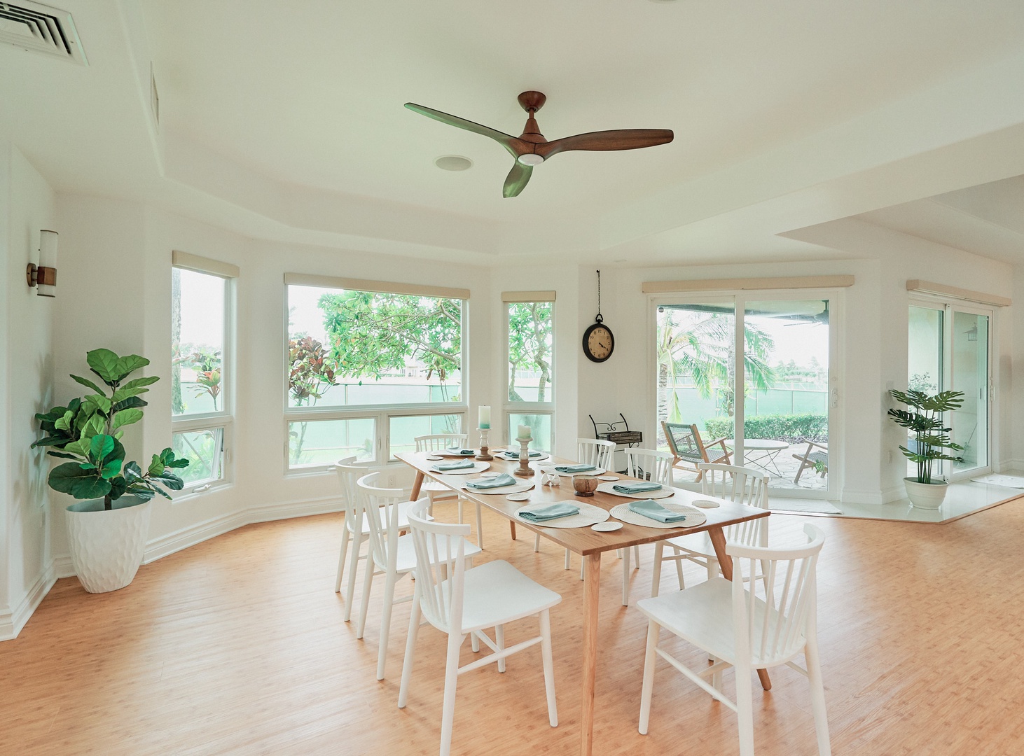Princeville Vacation Rentals, Hale Kai - Your bright dining space features large windows and a ceiling fan, perfect for memorable meals with tropical garden views.