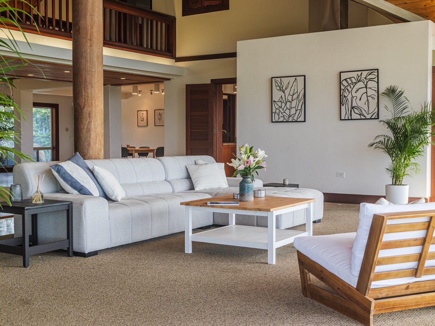Waianae Vacation Rentals, Konishiki Beachhouse - Elegant living room with plush seating and a warm, inviting atmosphere.