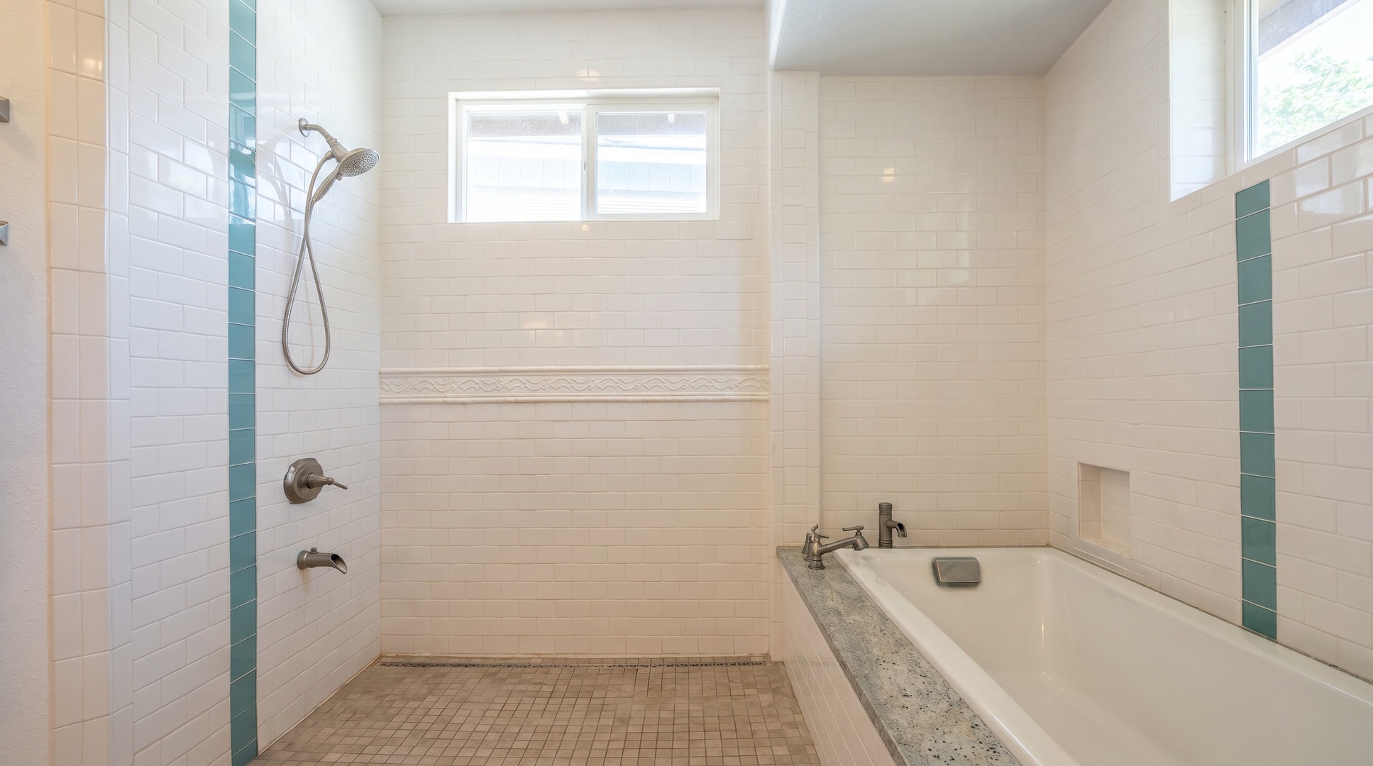 Walk-in shower and soaking tub side by side, for two people getting ready at once.