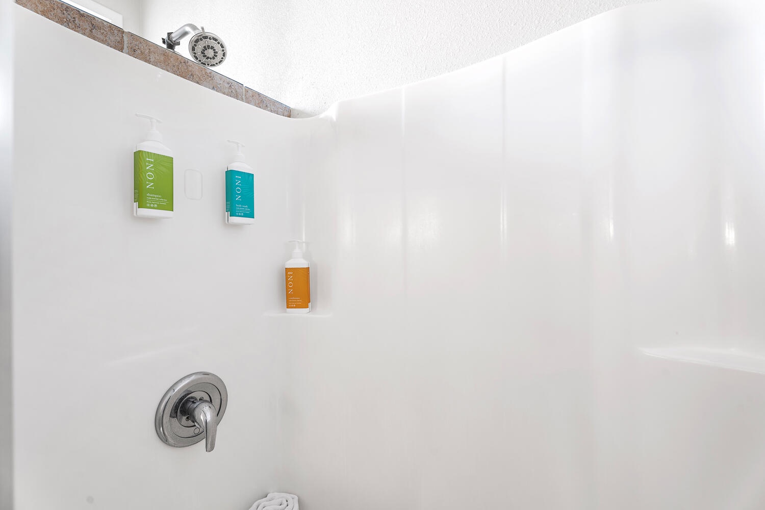 Kailua Kona Vacation Rentals, Kanaloa at Kona 3304 - Walk-in shower with built-in shelving and spa-inspired details.