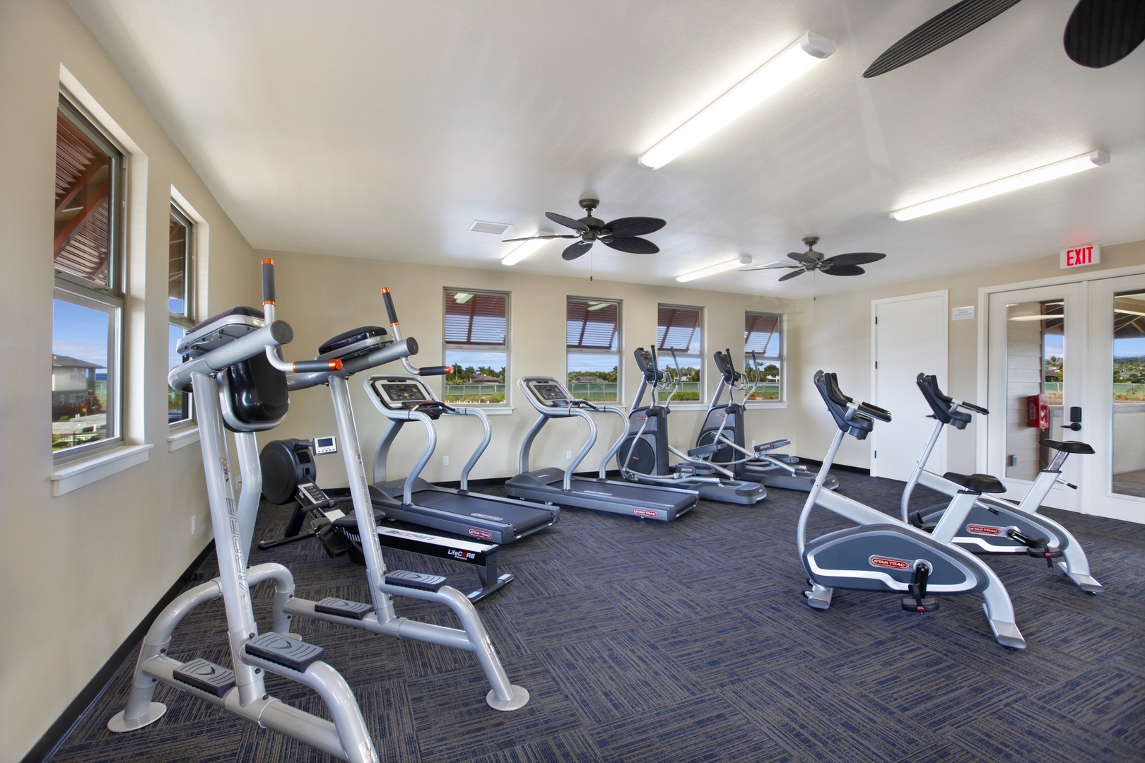 Koloa Vacation Rentals, Pili Mai 6J - Stay active during your getaway in this well-equipped fitness center with cardio machines, free weights, and natural light to energize your workout.