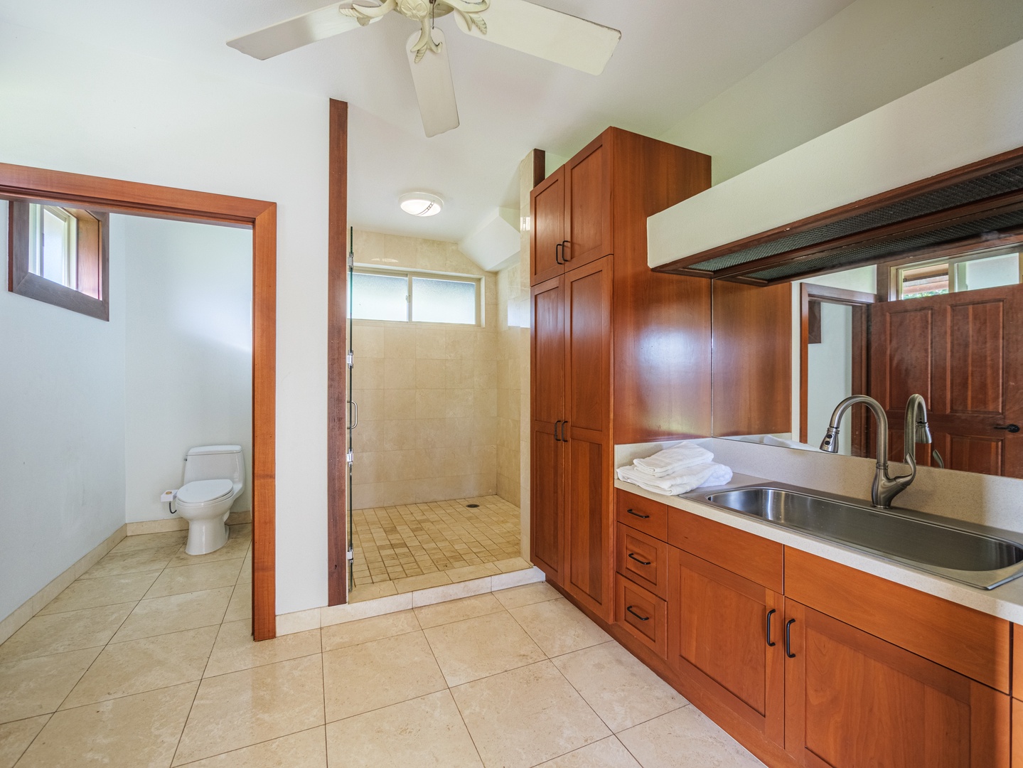 Waianae Vacation Rentals, Konishiki Beachhouse - Ensuite bathroom with an enclosed walk-in shower, closet and wide vanity area.