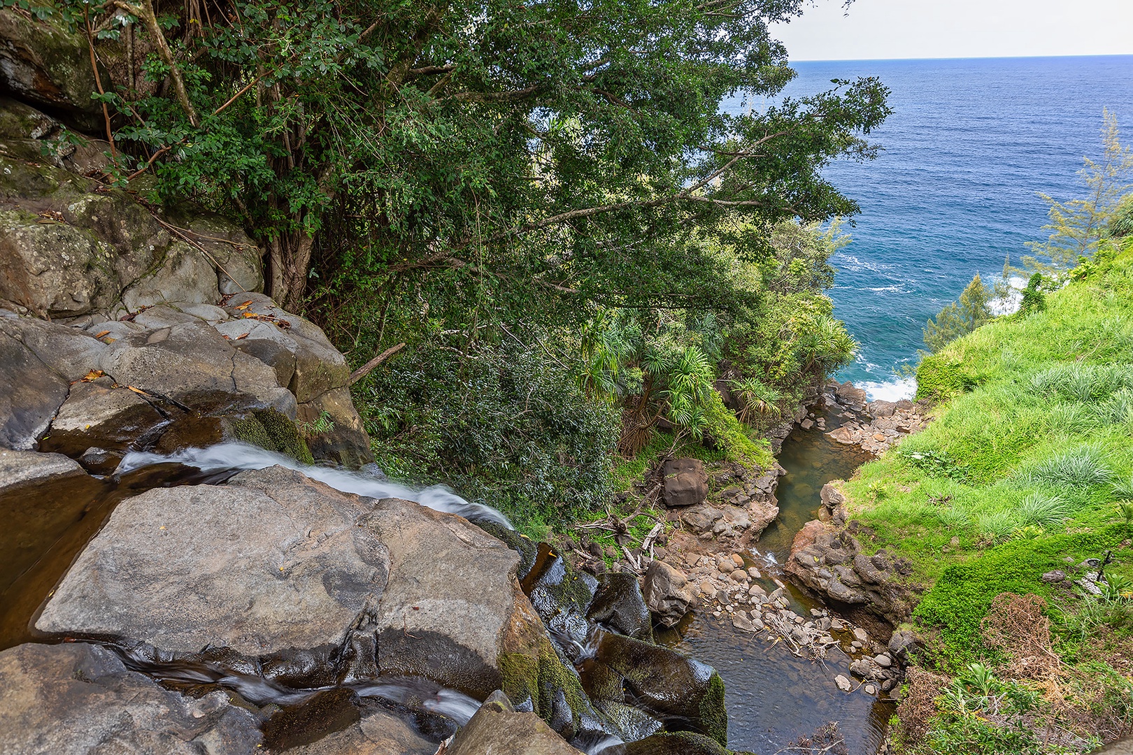 Ninole Vacation Rentals, Waterfalling Estate - View from the uppermost waterfall pool down into the ocean.