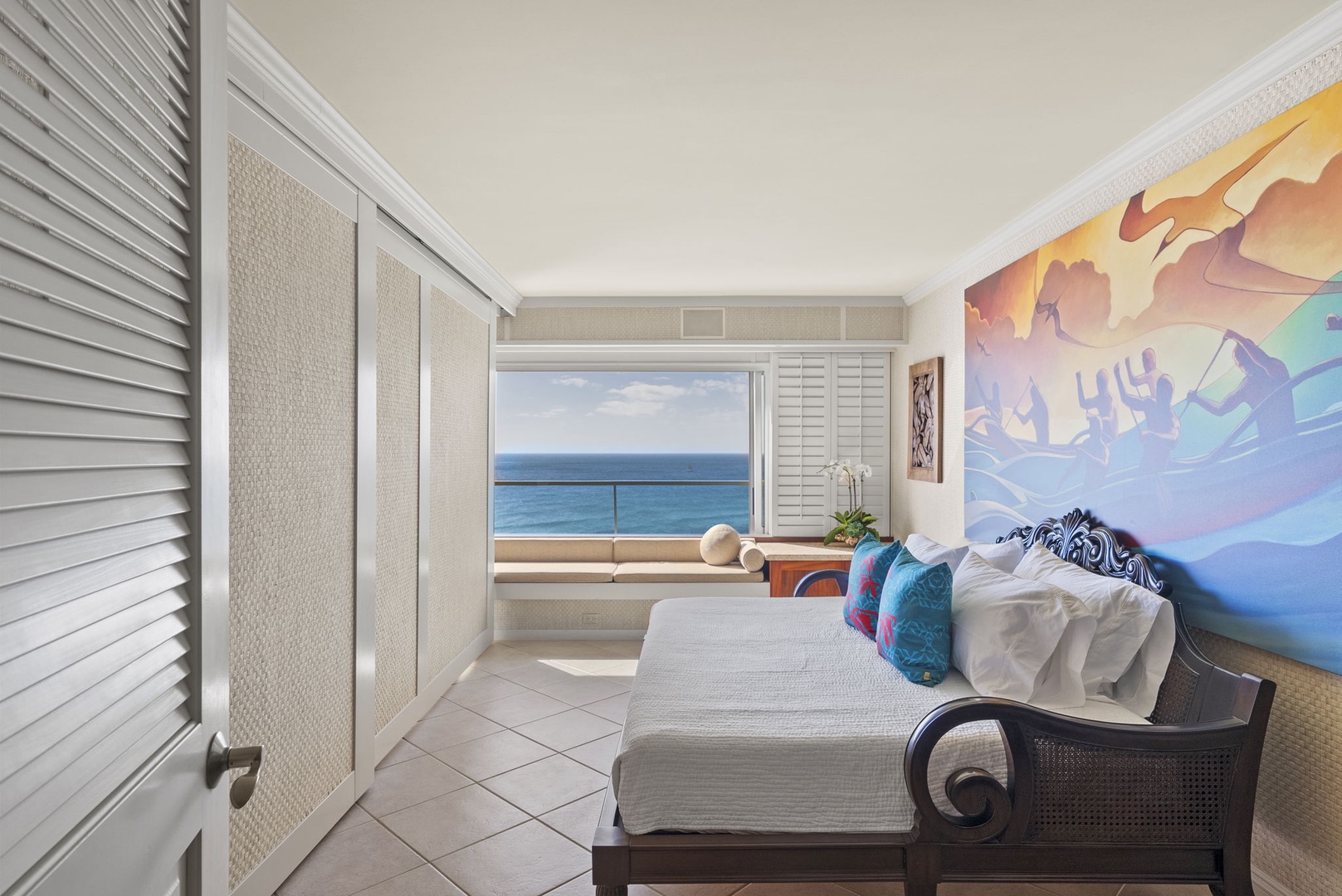 Honolulu Vacation Rentals, Hale Kaimana - This vibrant second bedroom features a colorful mural, a cozy sofa bed, and stunning ocean views.