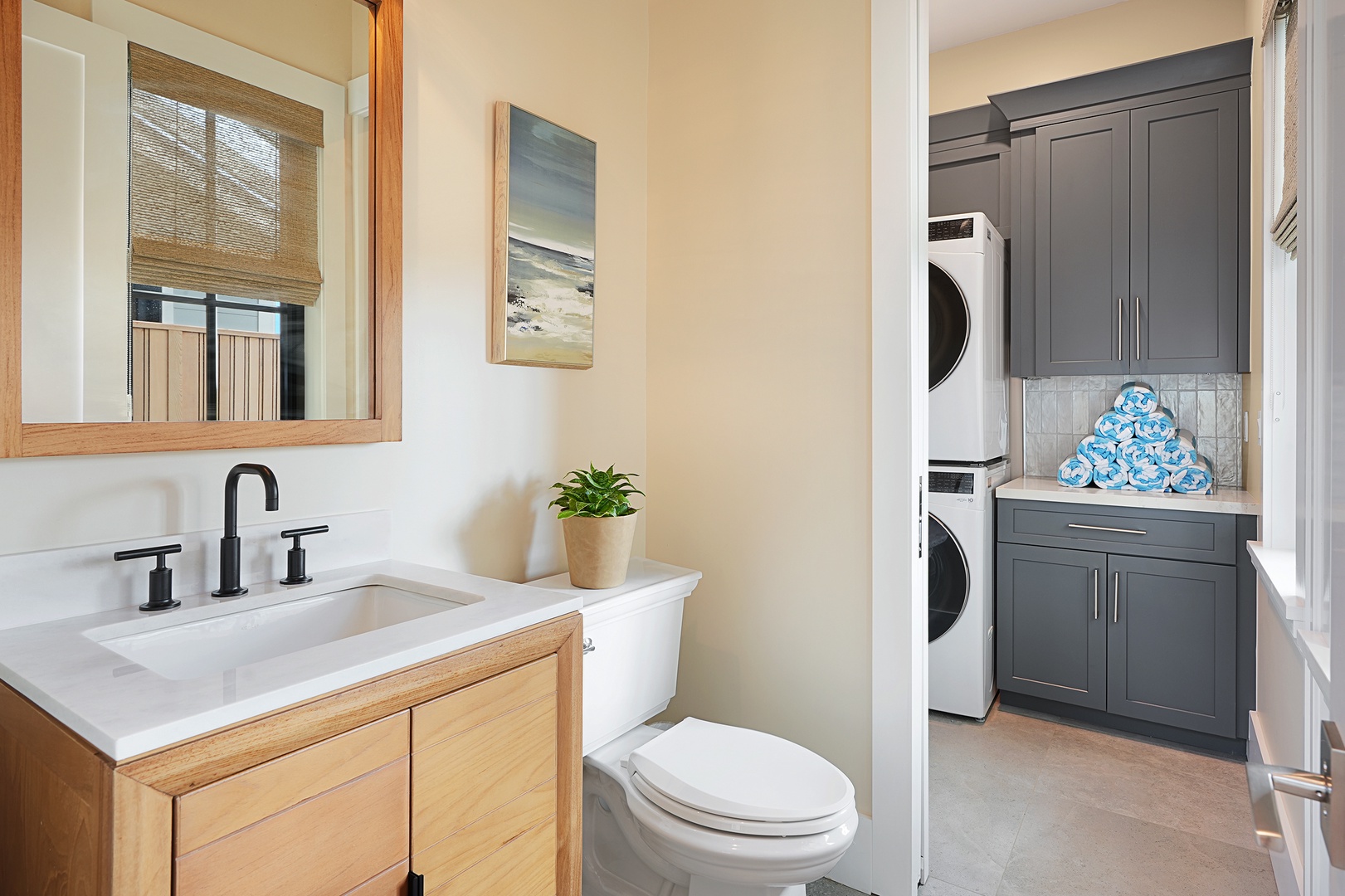 Koloa Vacation Rentals, Hali'a Mai - A full vanity and stacked laundry tucked nearby, the practical corner that makes a long stay simple.