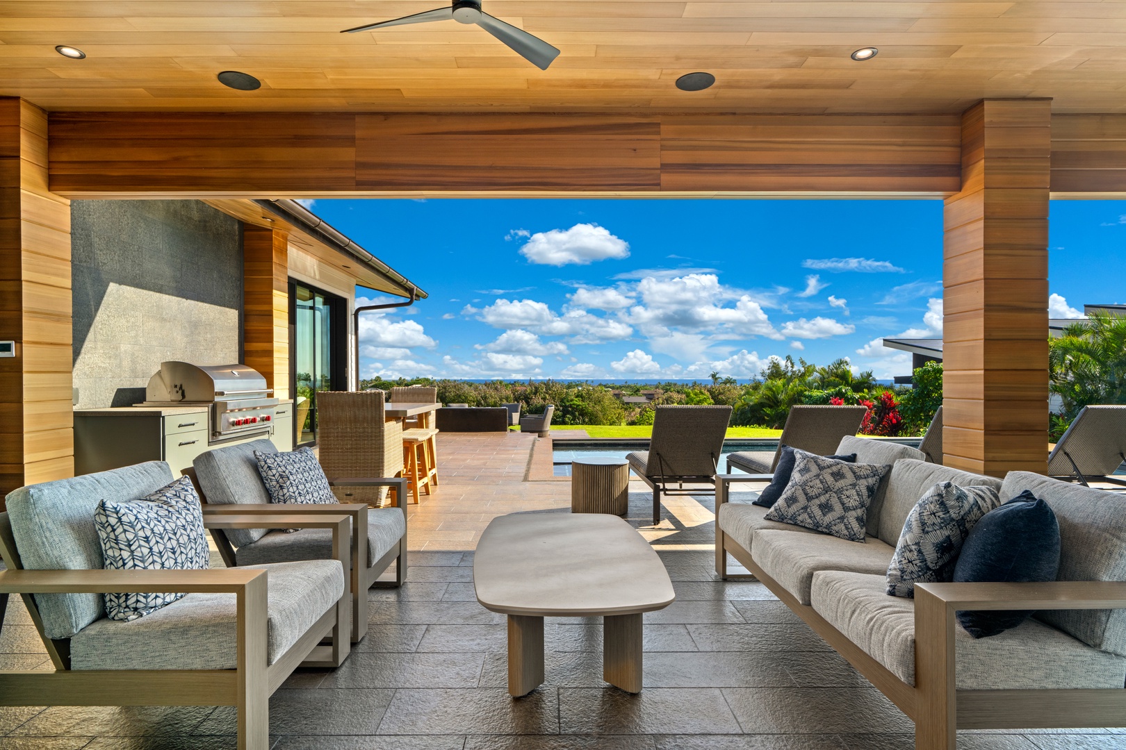 Koloa Vacation Rentals, Hale Laule'a at Kukui'ula - Relax in your covered outdoor living space with panoramic views and BBQ kitchen for memorable gatherings.