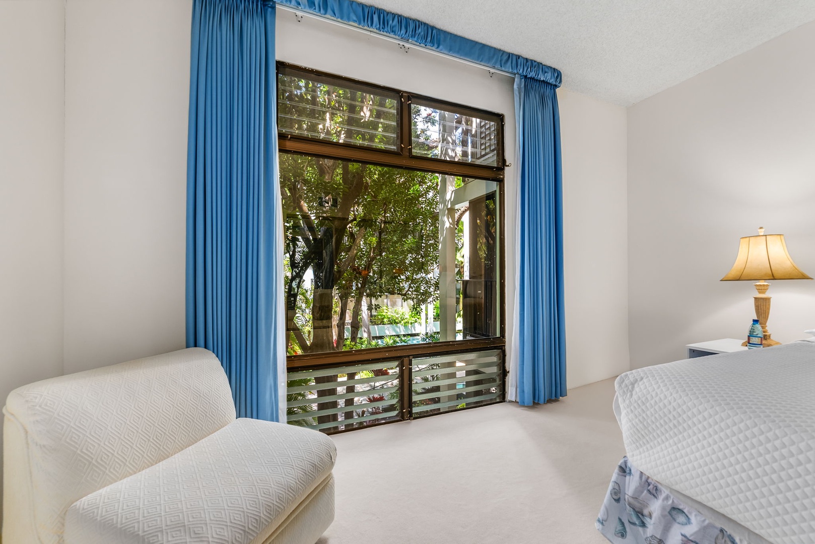 Honolulu Vacation Rentals, Kahala Beachfront Villa - Wake up to the tropical views from the primary.