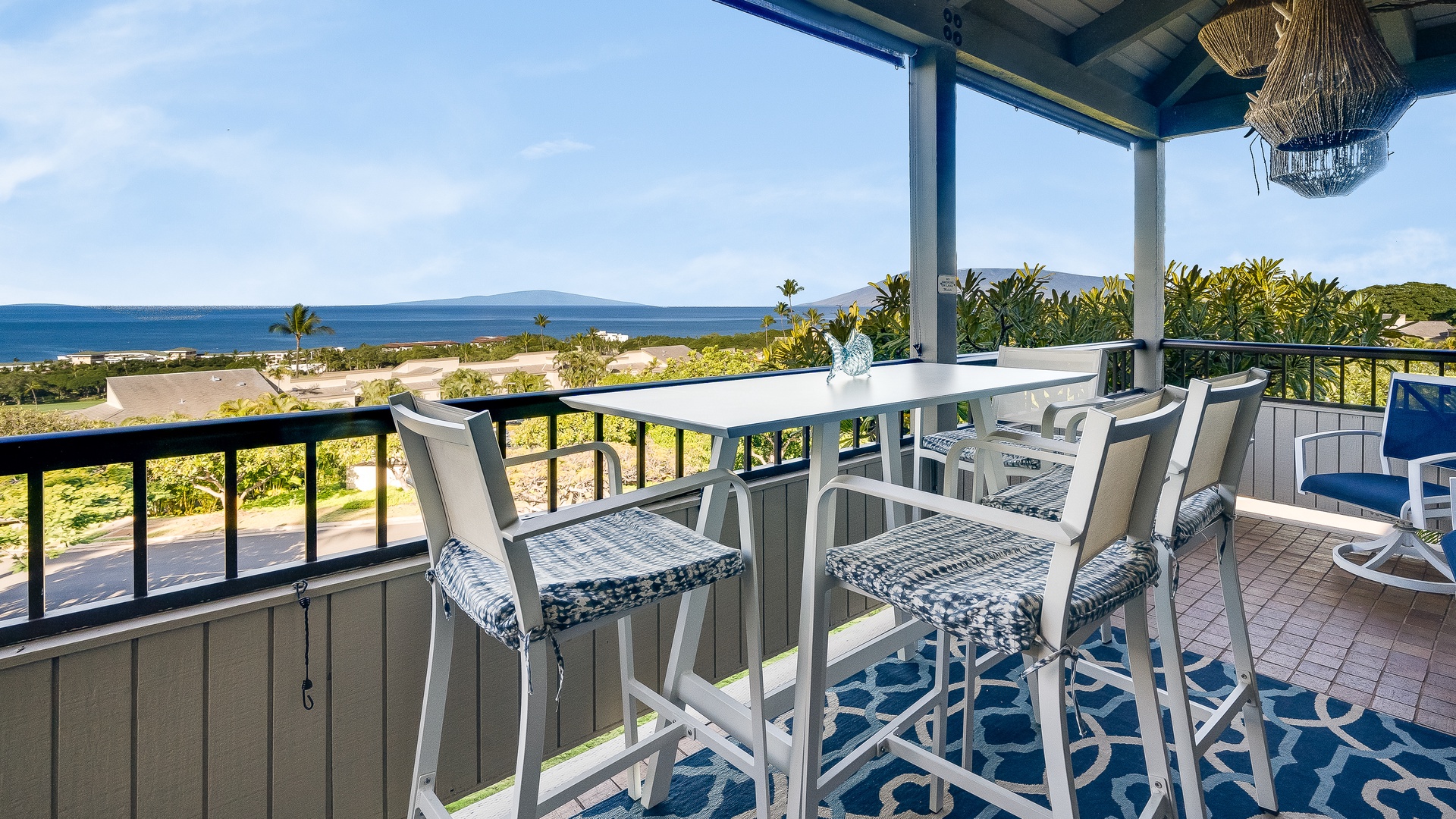 Kihei Vacation Rentals, Wailea Ekolu 1106 - Relax on the lanai with stunning ocean views, perfect for enjoying a refreshing drink while soaking in the serene surroundings.