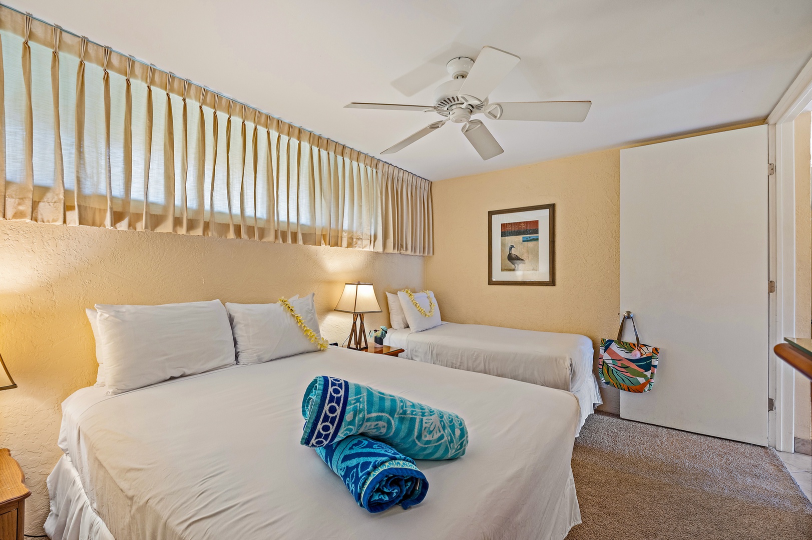 Lahaina Vacation Rentals, Papakea G-306 - The guest bedroom provides flexible sleeping arrangements with a queen and twin bed, perfect for accommodating both family and friends comfortably.