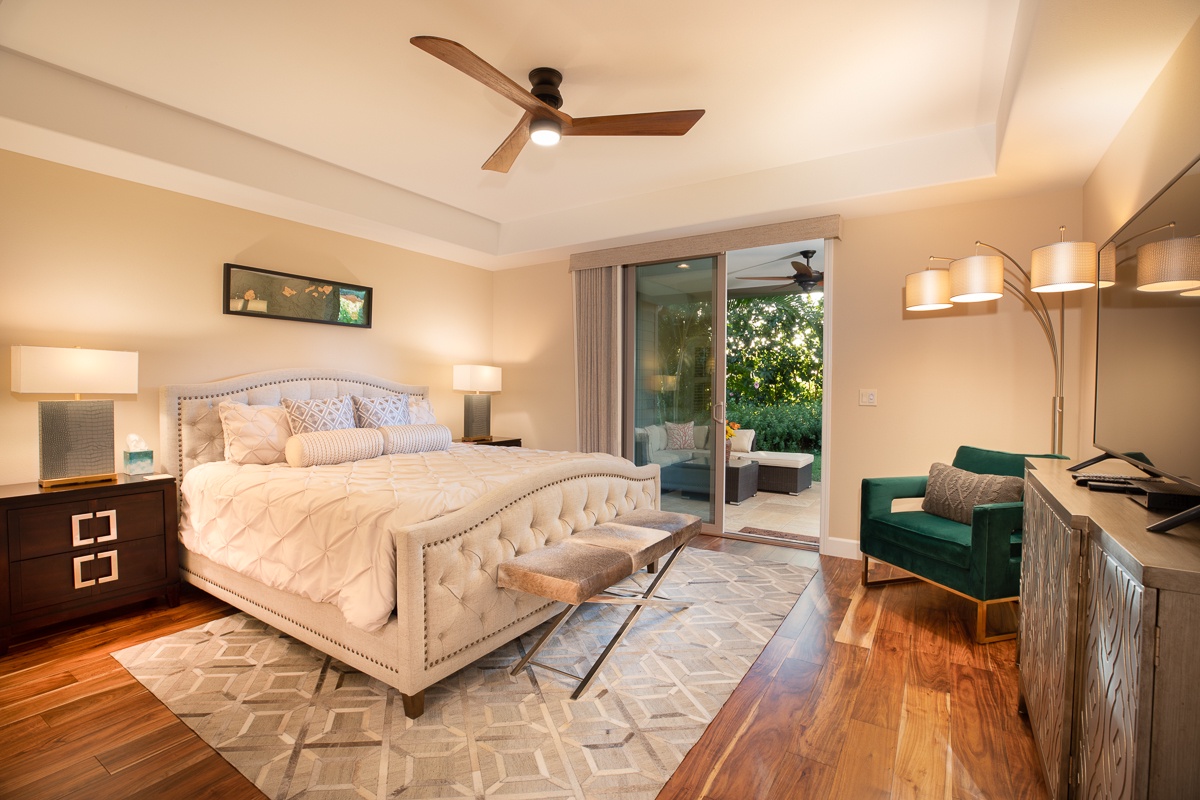 Kamuela Vacation Rentals, Mauna Lani KaMilo #123 - Lower-level primary suite has a luxurious king bed, private patio and private big screen TV, with a spa like en-suite, all for your refined rest and relaxation.