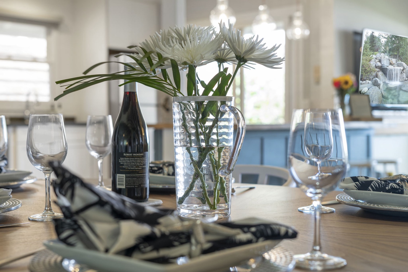 Haleiwa Vacation Rentals, Hale Nalu (Lower Level) - Elegant tabletop setting with fresh flowers and wine—ready for a memorable island meal.