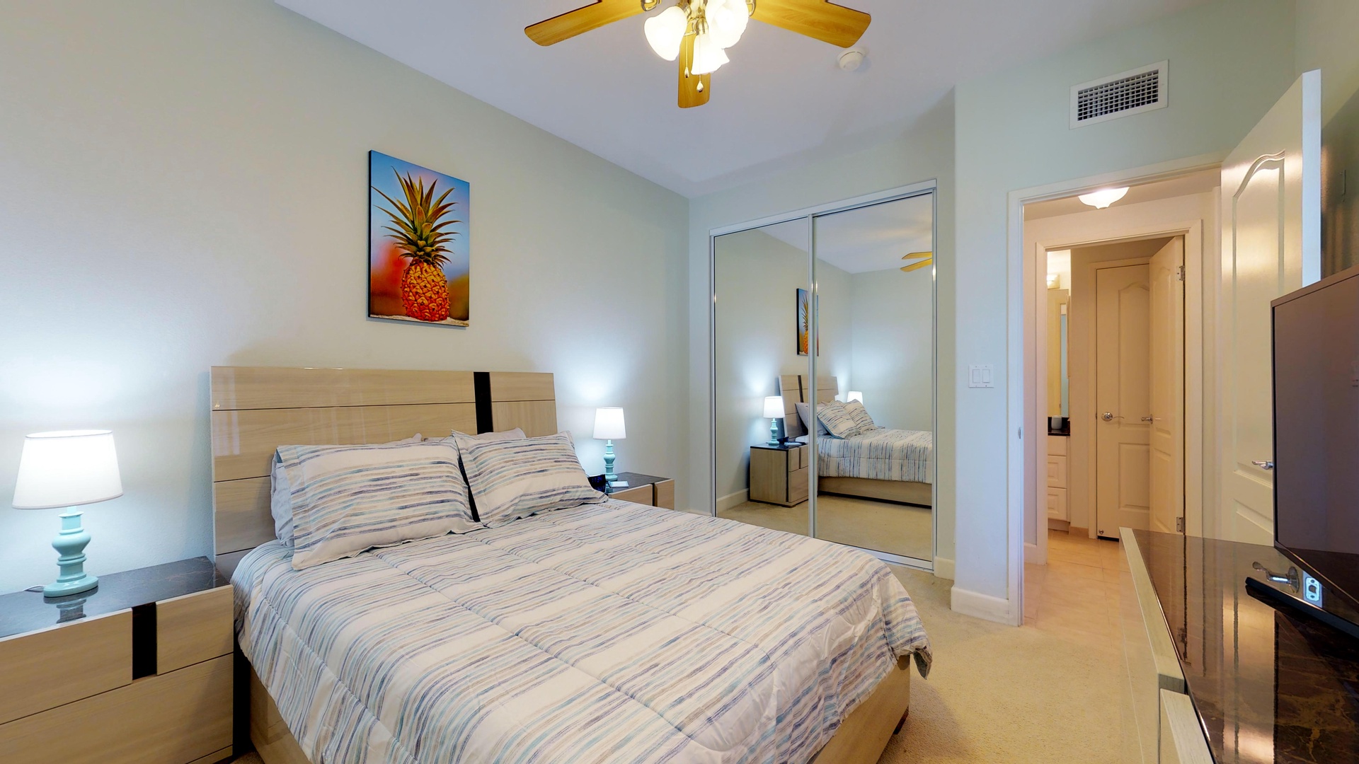 Kapolei Vacation Rentals, Ko Olina Kai 1035D - The downstairs guest bedroom with a queen bed and TV.