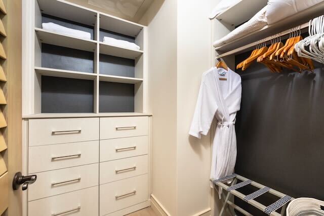 Kailua Kona Vacation Rentals, 3BD Palm Villa (130B) at Hualalai Resort - Spacious guest closet with built-in storage and thoughtful organization.