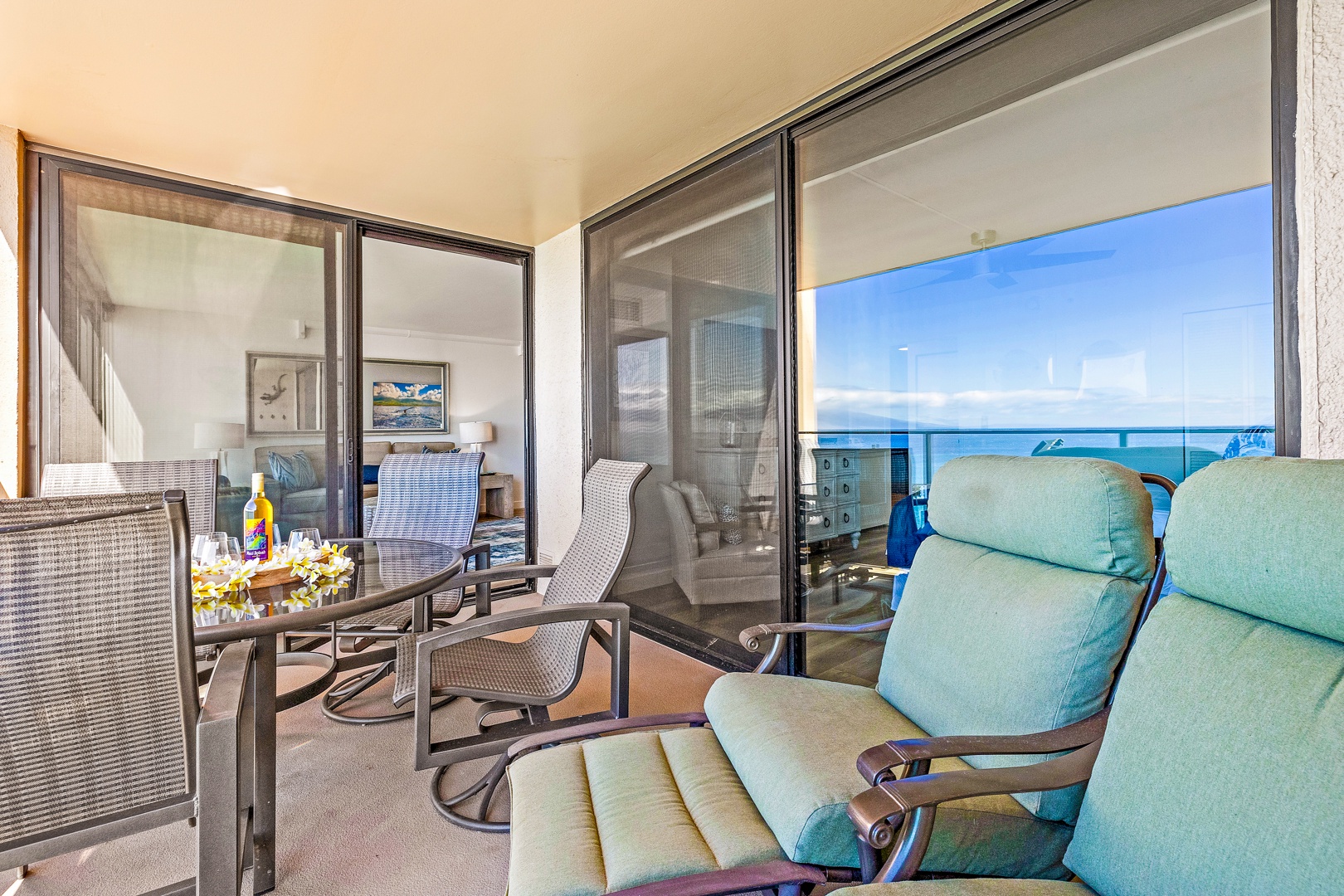 Lahaina Vacation Rentals, Mahana 1118 - The lanai offers plush seating and a stunning view of the ocean, providing the perfect spot to unwind with a cool drink or enjoy a peaceful morning coffee