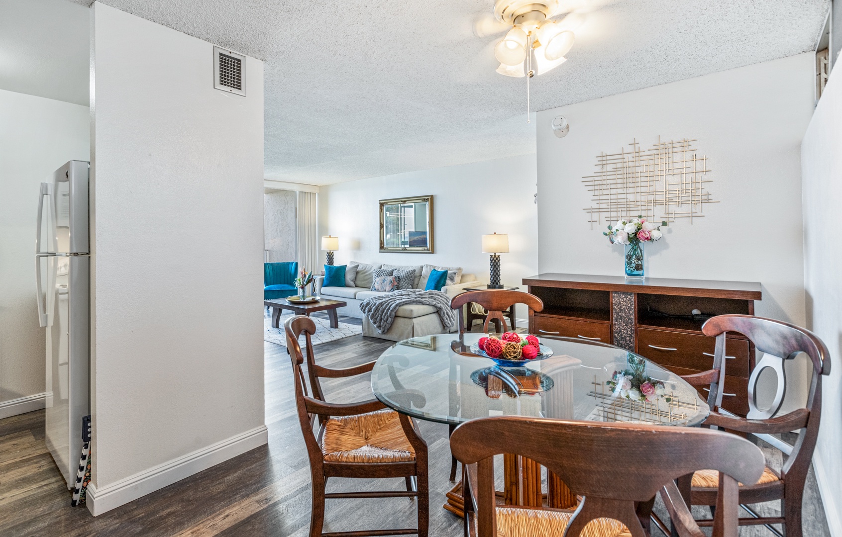 Lahaina Vacation Rentals, Royal Kahana 308 - The dining area features a glass table and comfortable seating, seamlessly connecting to the living space, perfect for casual meals or entertaining.