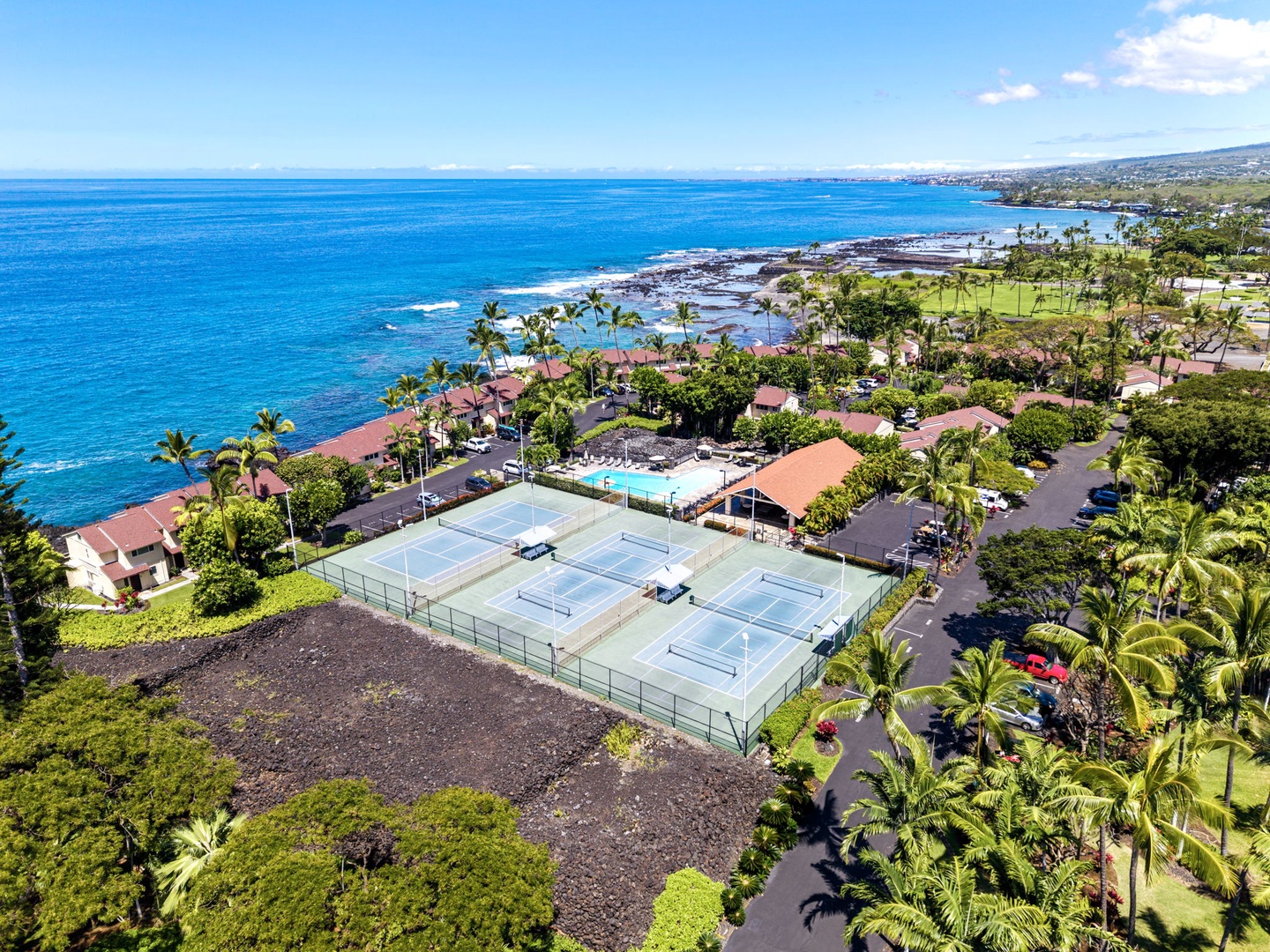 Kailua Kona Vacation Rentals, Keauhou Kona Surf & Racquet 1104 - From above, the grounds sit right on the lava coast with the water at the edge.
