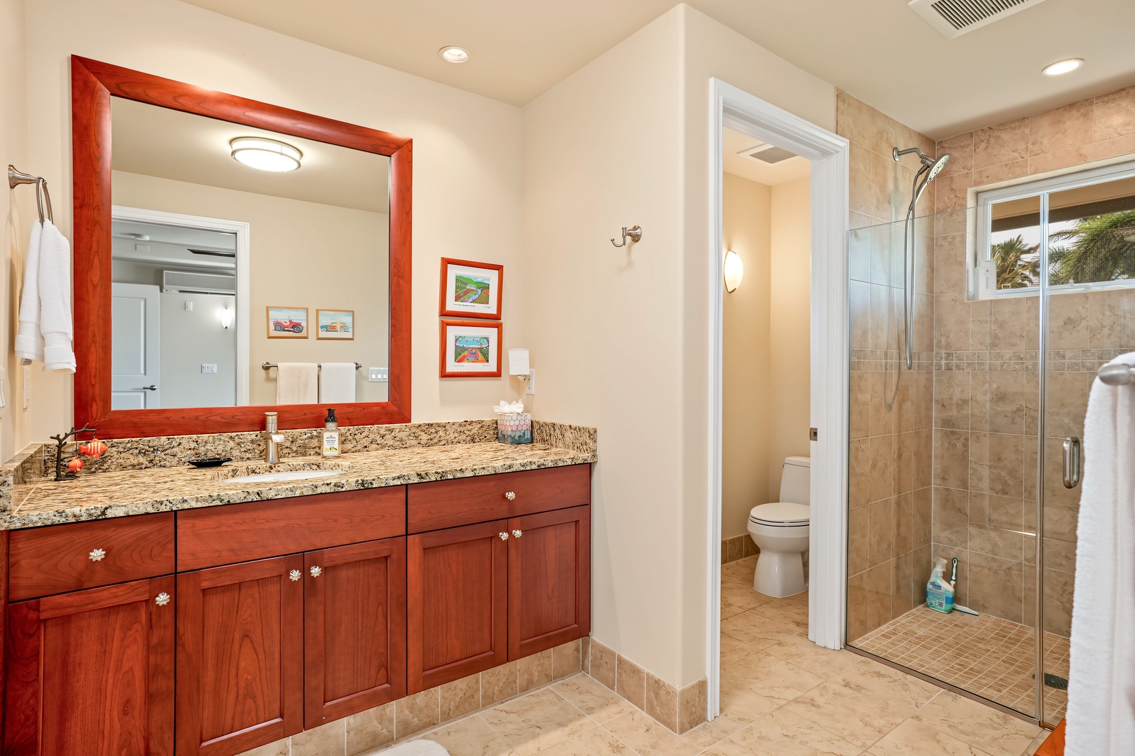 Princeville Vacation Rentals, Hale Hau'oli Moku - Walk-in shower and a granite vanity, sized for getting the sand off after a day outside.