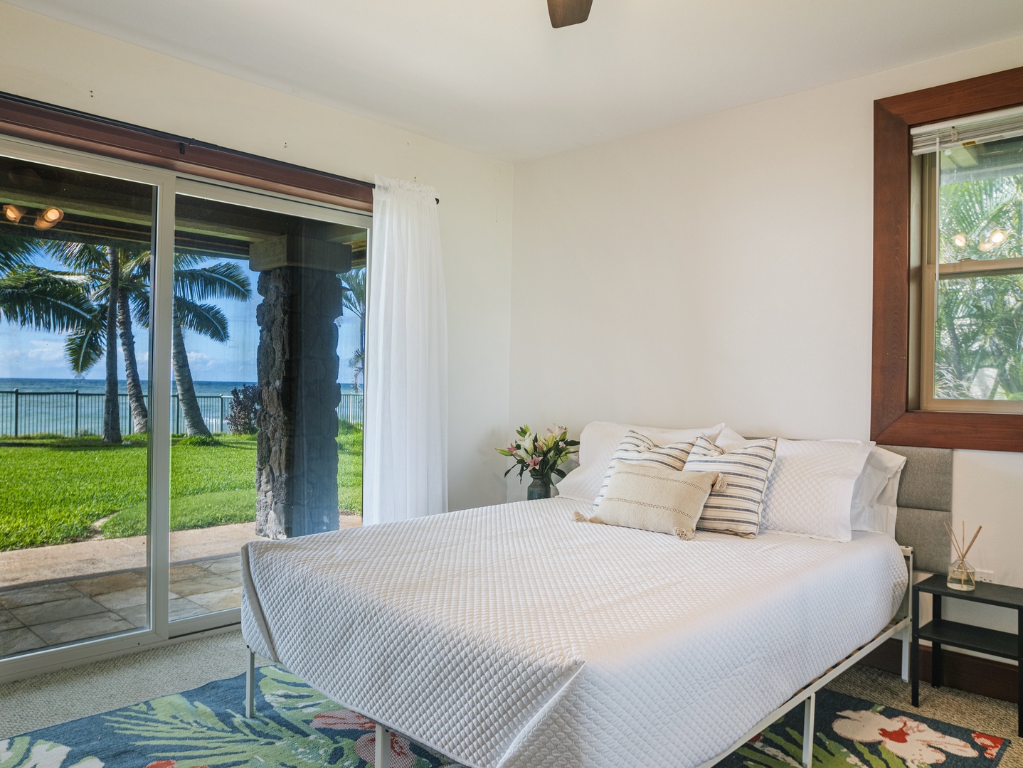 Waianae Vacation Rentals, Konishiki Beachhouse - Guest suite with access to outdoors, a perfect spot to be greeted in the morning by nature.