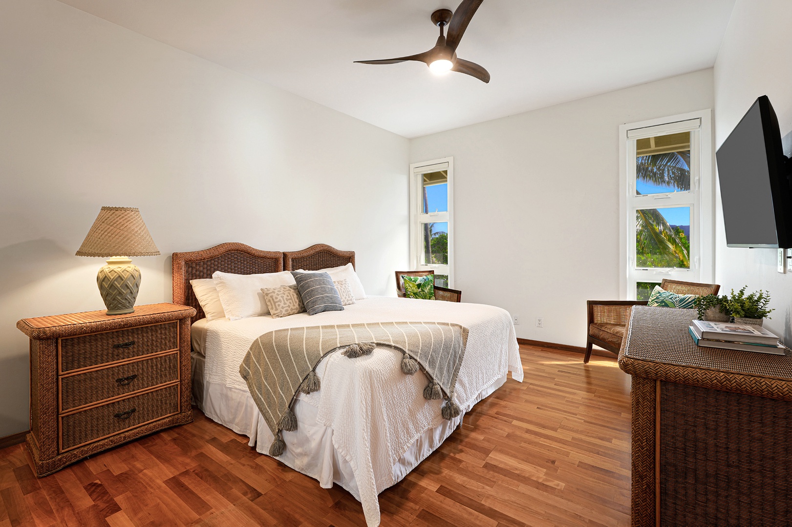 Koloa Vacation Rentals, Whalers Cove #133 - Bright and airy primary bedroom with a king bed, ceiling fan, and tropical décor.