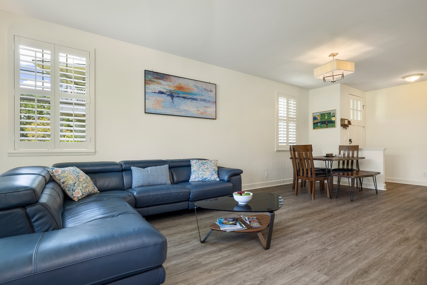 Kapolei Vacation Rentals, Ko Olina Kai 1061F - Unwind in your spacious living room with plush leather seating and warm natural light streaming through plantation shutters.