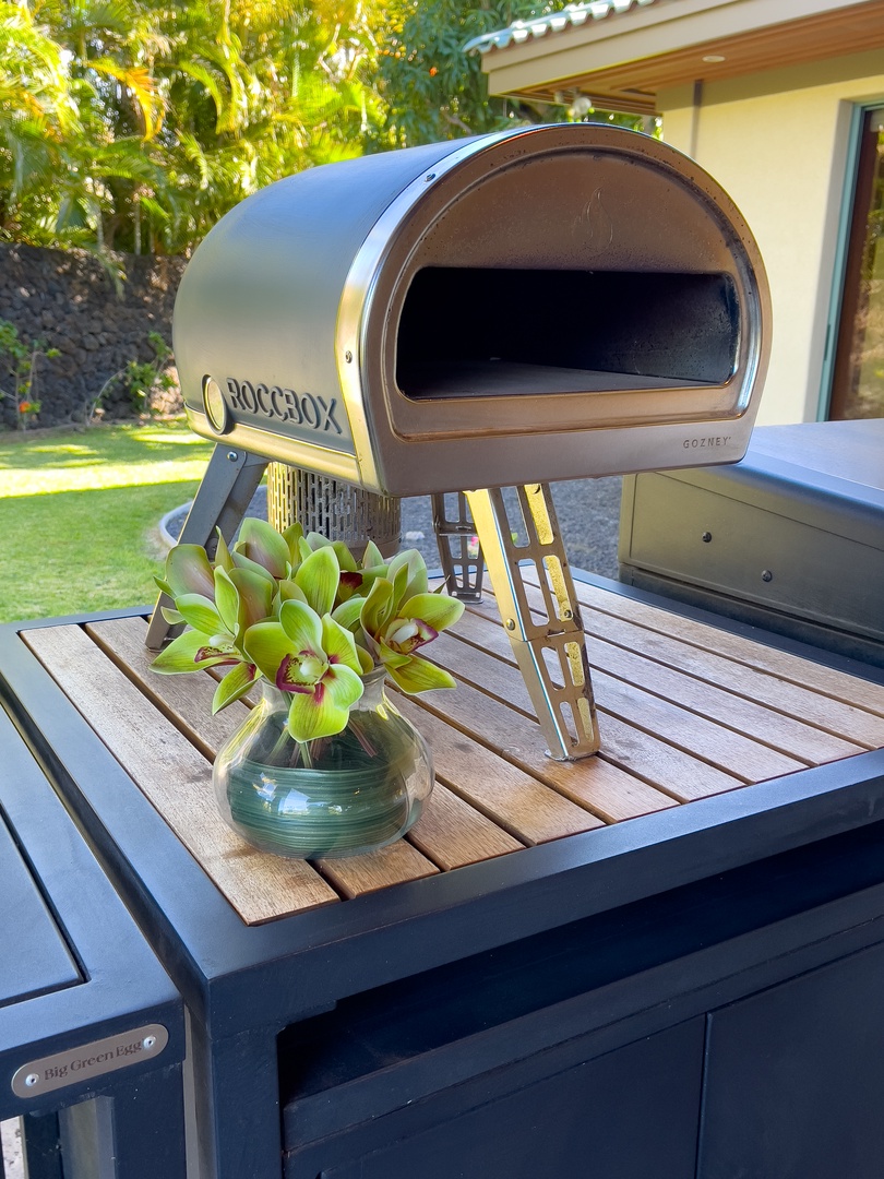 Kamuela Vacation Rentals, Champion Ridge Elegance - Gas-fired pizza oven, adding a unique culinary touch to outdoor dining.