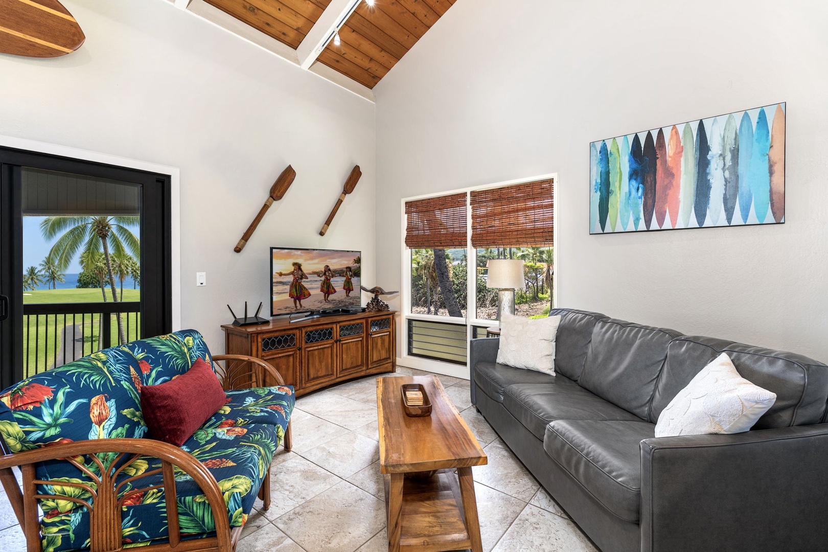 Kailua Kona Vacation Rentals, Kanaloa at Kona 1606 - Sliding doors open the living room straight onto the lanai and the greenery beyond.